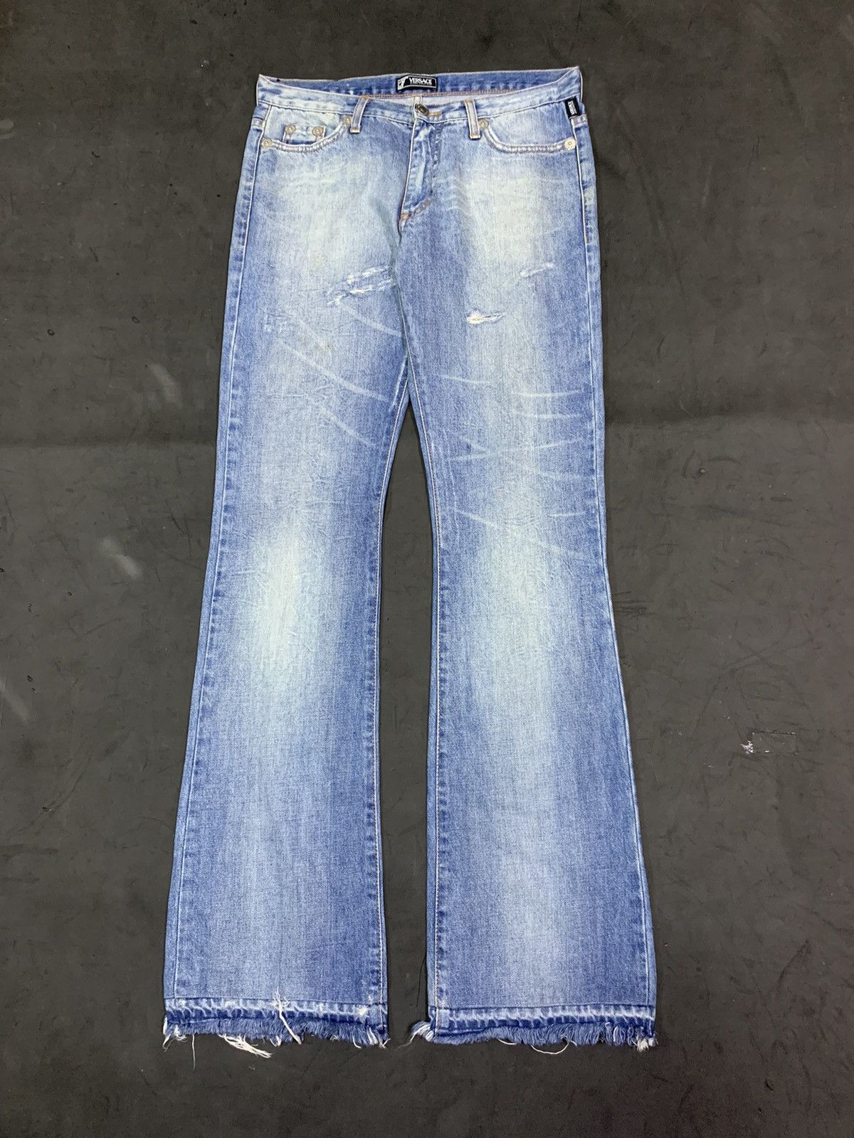 image of Versace Distressed Flared Jeans in Blue, Women's (Size 31)