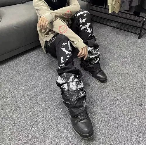 VIBE Washed distressed pleated micro-flare bat-print jeans Size US 32 / EU 48 - 8 Thumbnail