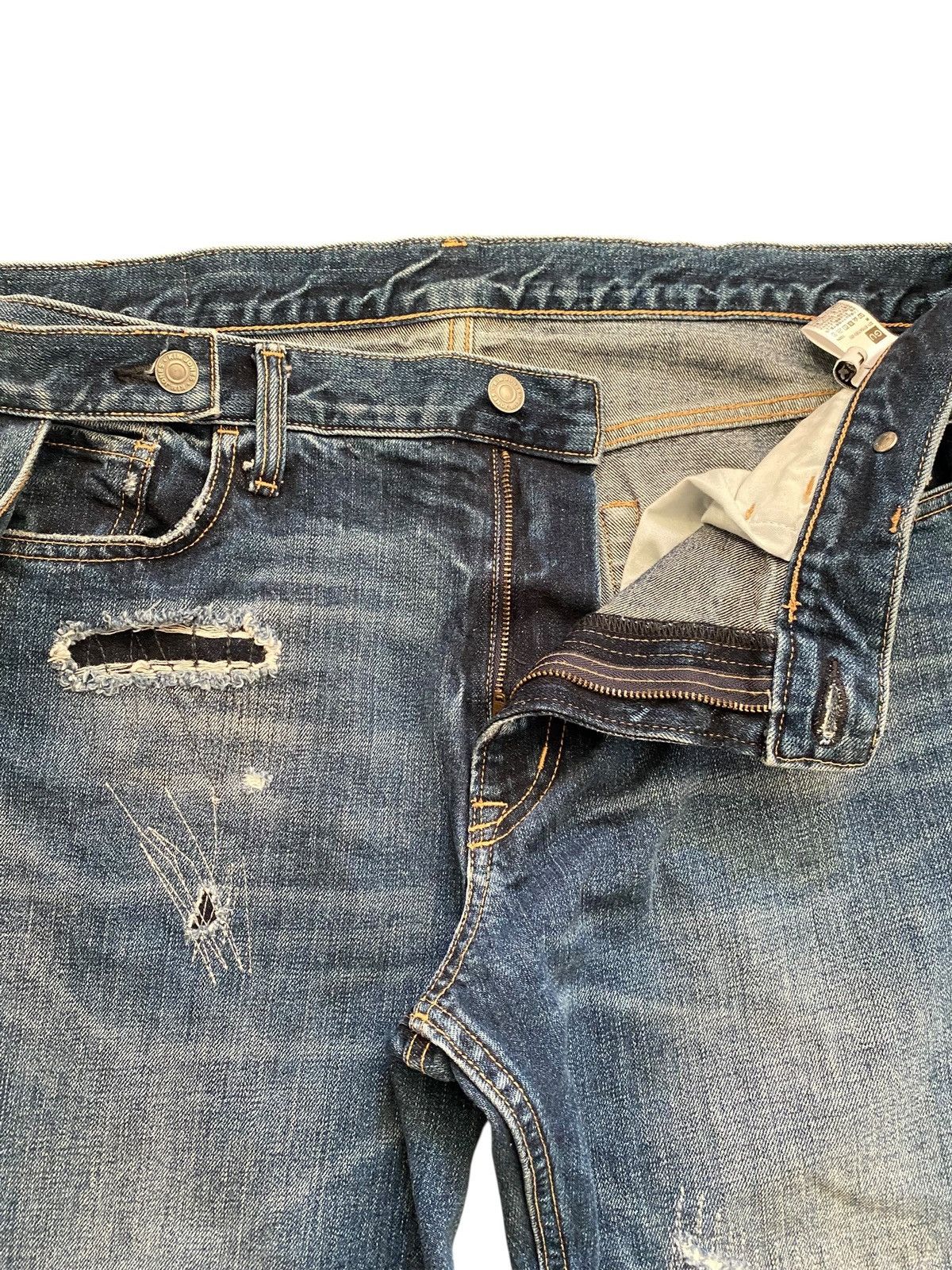 Kim Jones x GU distressed bondage denim