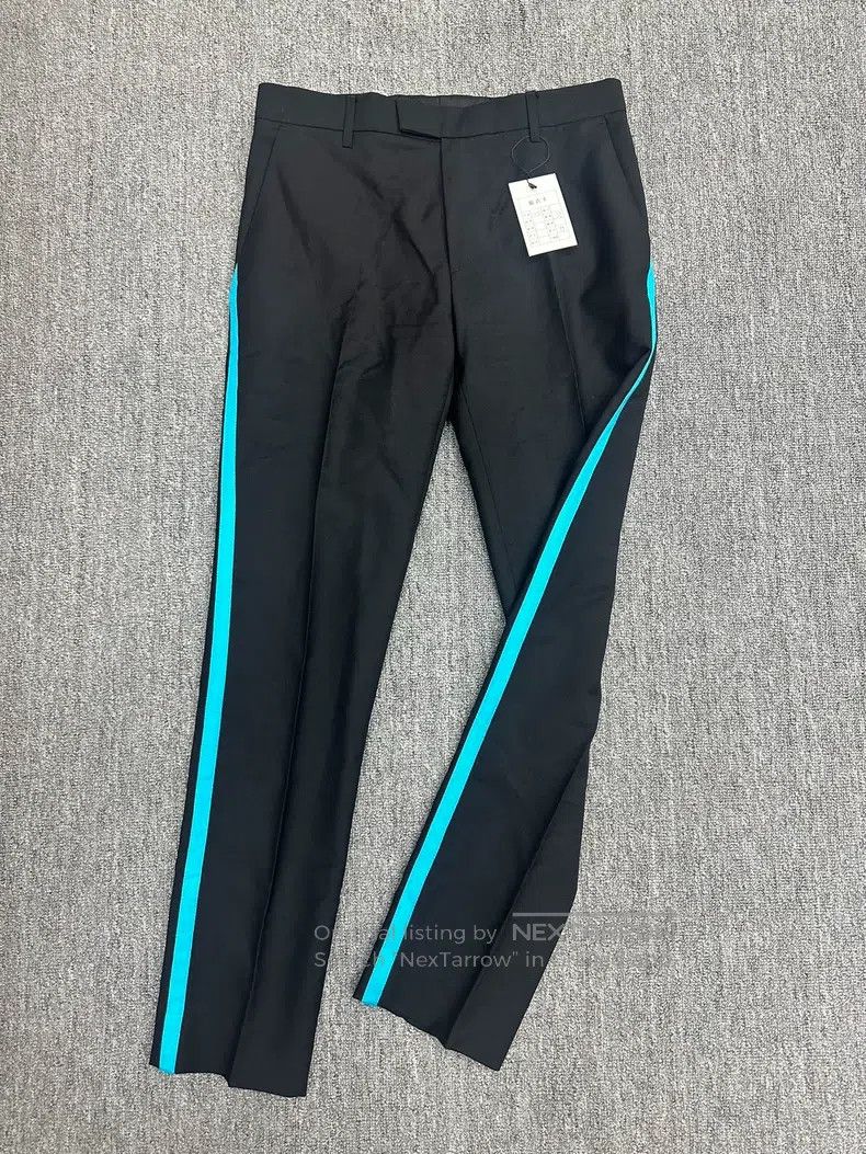 Raf Simons Wide fit pants with horizontal cut and suspenders SS20