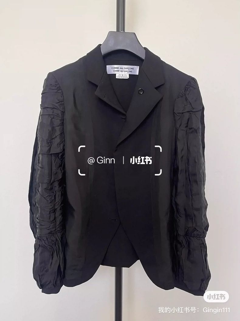Comme Des Garcons Wear a suit jacket on both sides.