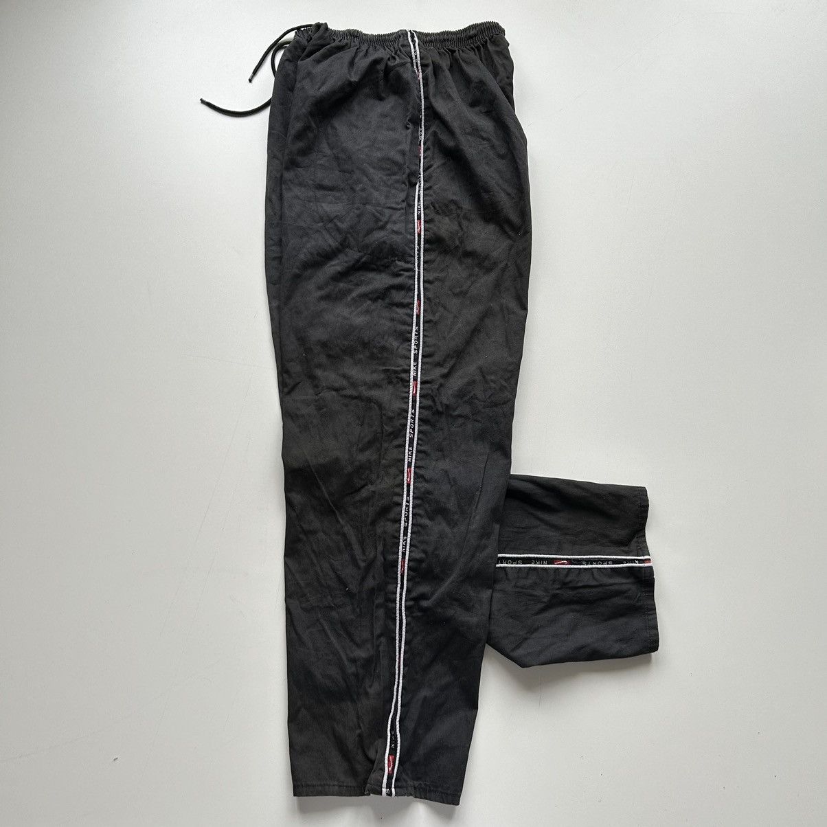 image of 90's Nike Sports Bootleg Swoosh Track Pants Medium in Black, Men's (Size 30)