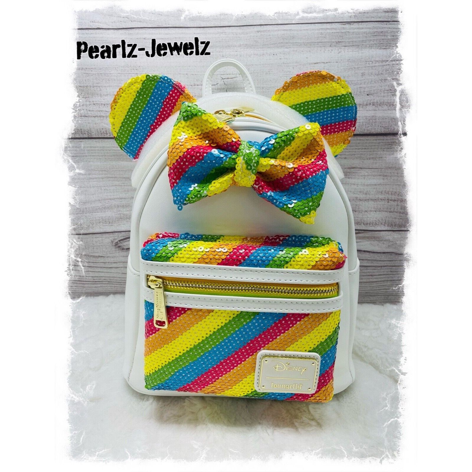 image of Disney Loungefly Minnie Mouse Sequin White Rainbow Mini Backpack, Women's