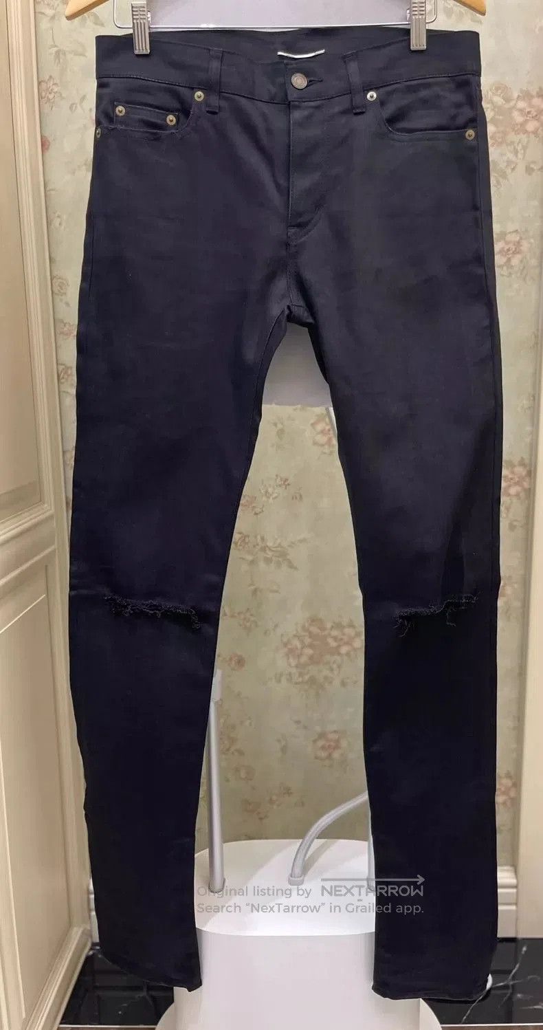 Saint Laurent Distressed Black Denim Jeans.