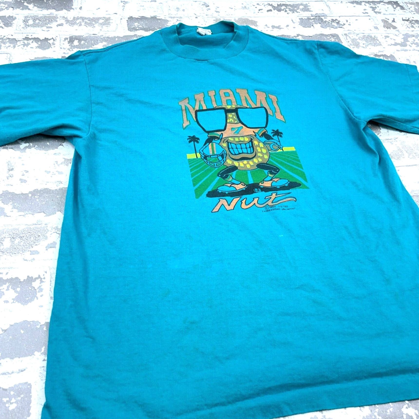 Vintage VINTAGE Miami Nut Shirt Men Large Blue Tee Single Stitch 80s Florida Football Shirt Men Blue 80s Retro Graphic Print Football Size US L / EU 52-54 / 3 - 4 Thumbnail