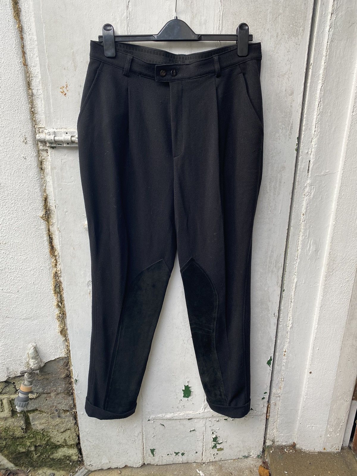 image of Prada Leather/rubber Accented Trousers in Black, Men's (Size 33)