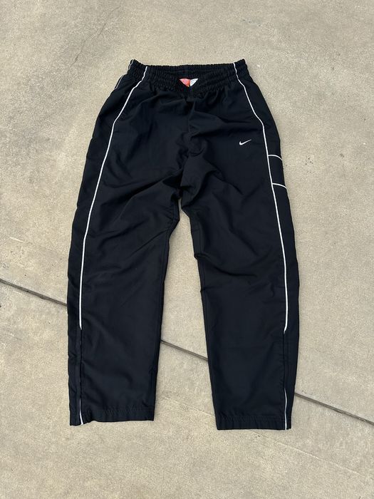 90's vintage black nike track pants, has lined