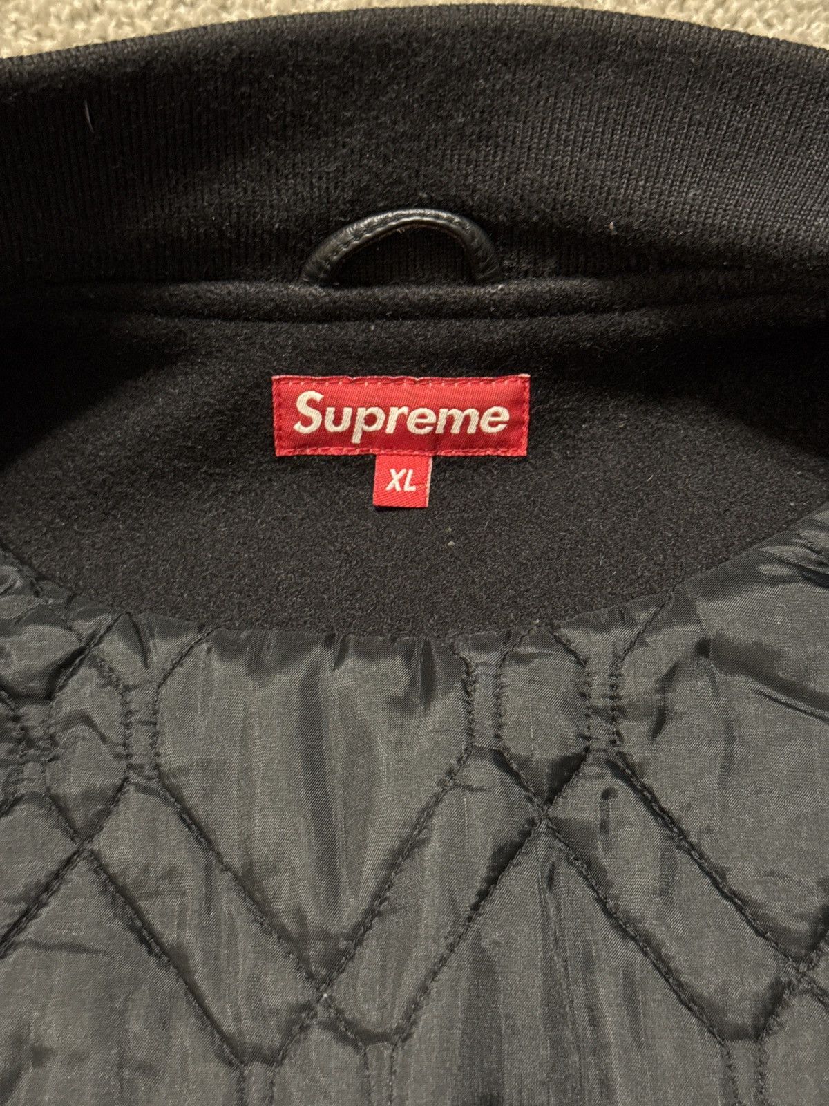 Supreme “In god we trust” varsity jacket