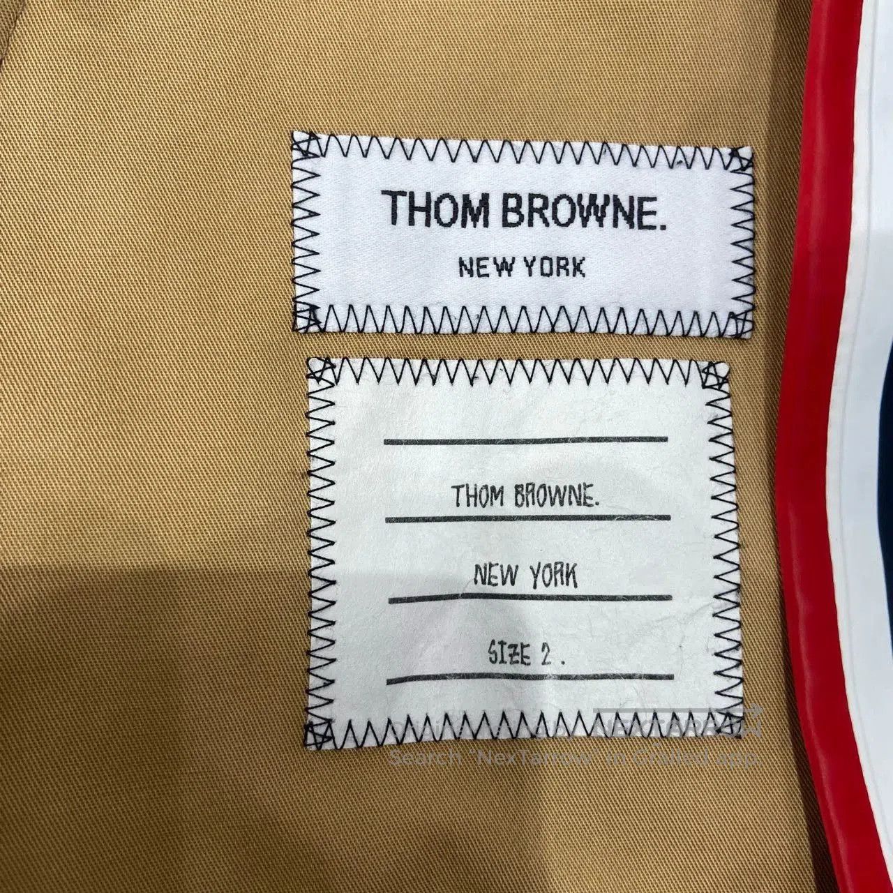 thom browne navy blue jacket with wear marks.