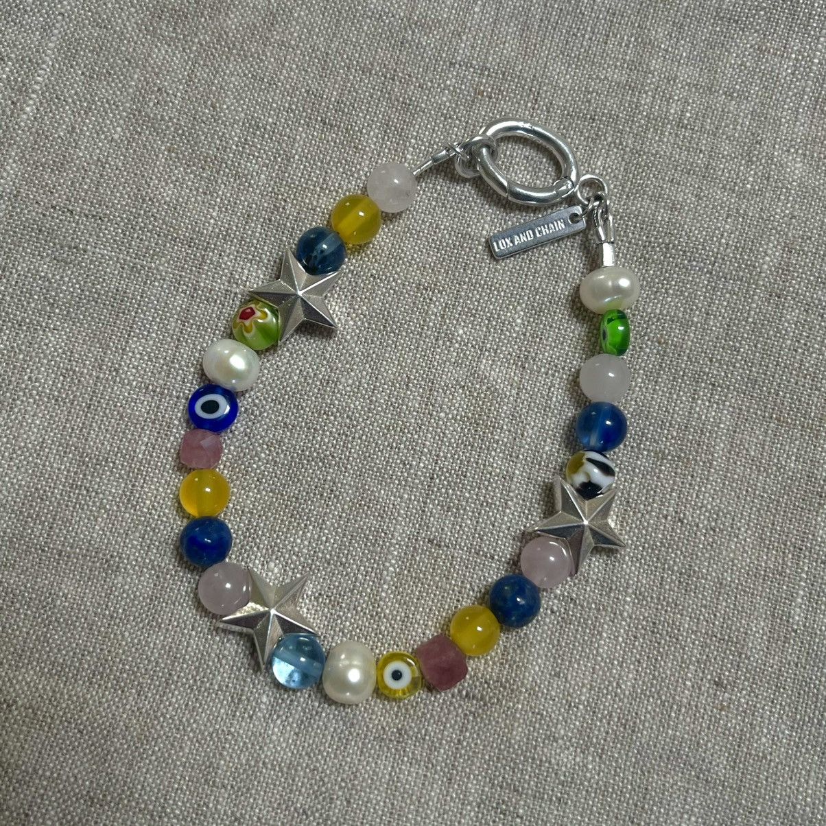 bazo1199 white on black stars bracelet | ヤマダウェブコム