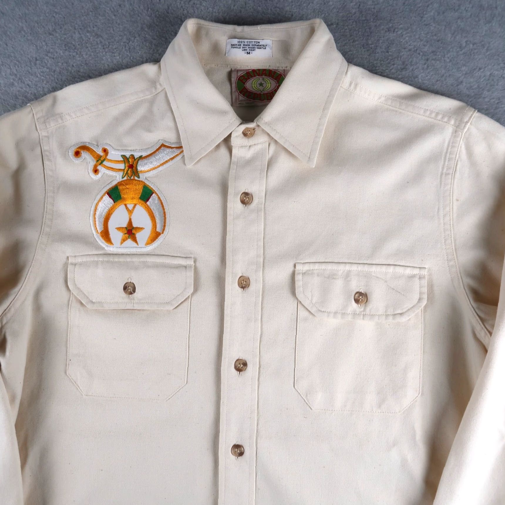Banana Republic VINTAGE Banana Republic Shrine Club Shriners Patch Button Shirt Sz M Ivory 80s 70s Mens T-Shirt Cotton Collared Button Front Solid Pattern - 1980s Size US M / EU 48-50 / 2 - 3 Thumbnail