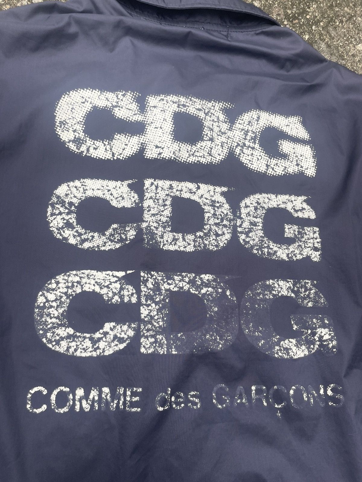 Cdg coach jacket fake sale