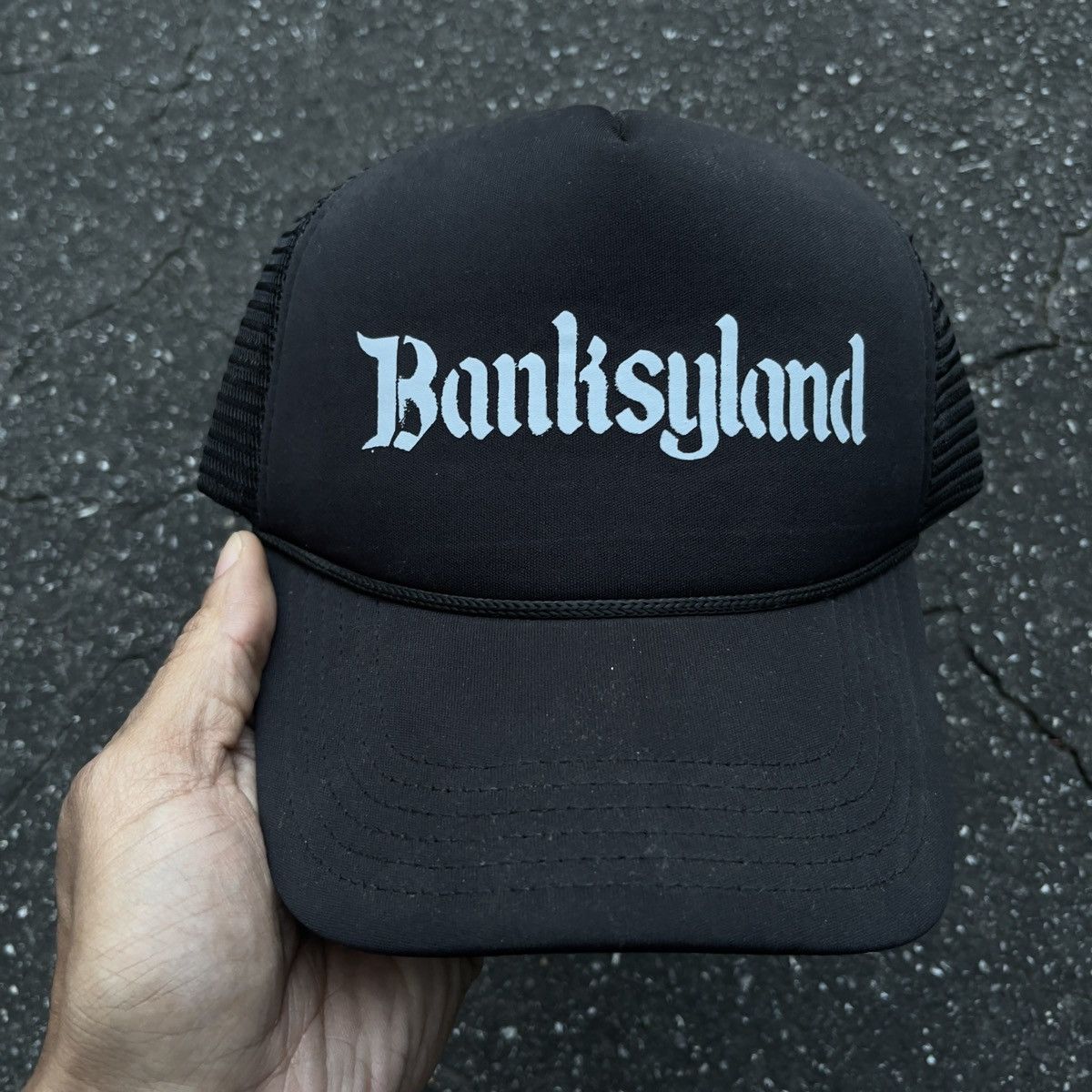 image of Art x Arts Science Banksyland Logo Trucker Hat in Black, Men's