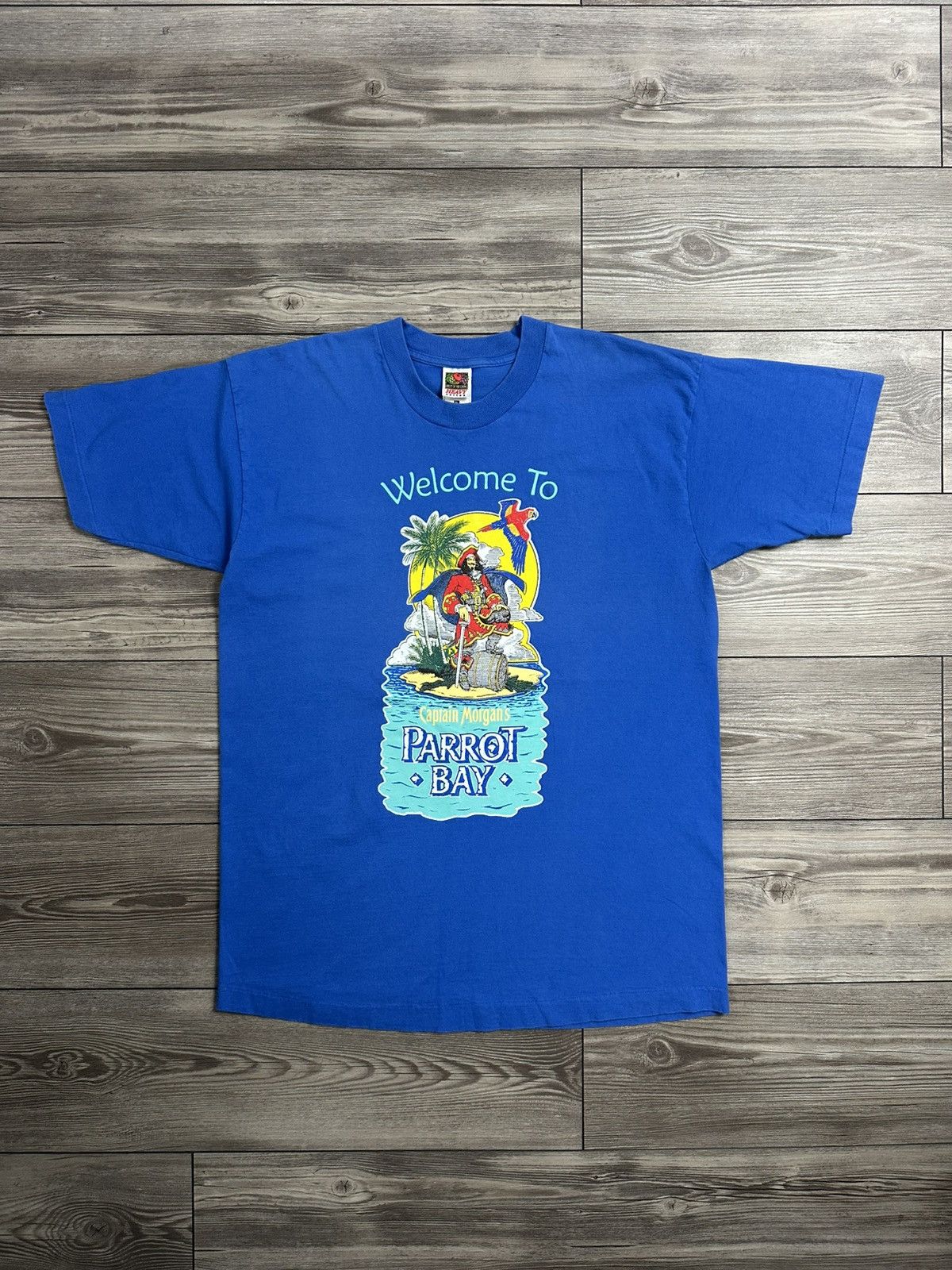 Fruit Of The Loom × Vintage Vintage 90’s Captain Morgans Parrot Bay T Shirt Size US XL / EU 56 / 4 - 1 Thumbnail