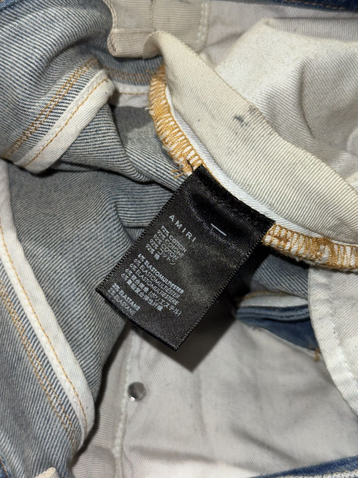 AMIRI BLUE DISTRESSED JEANS