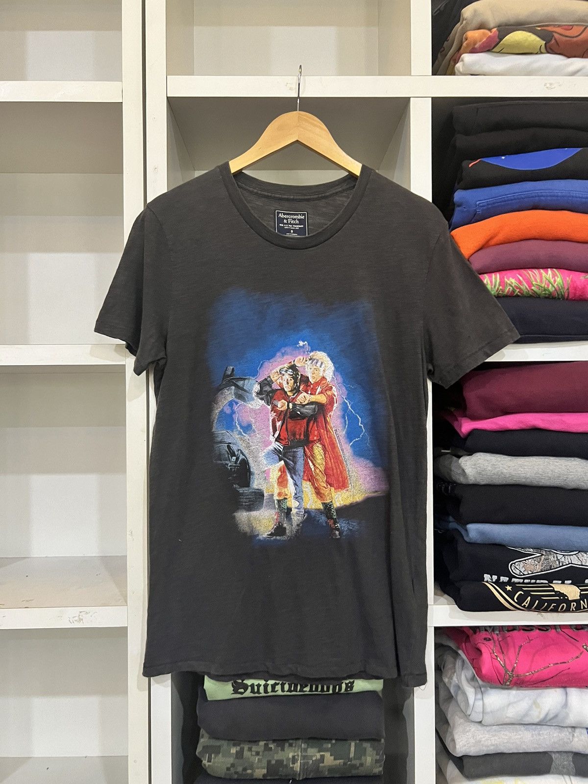 image of Abercrombie Fitch x Movie Back To The Future Movie By Abercrombie & Fitch in Faded Black (Size Smal