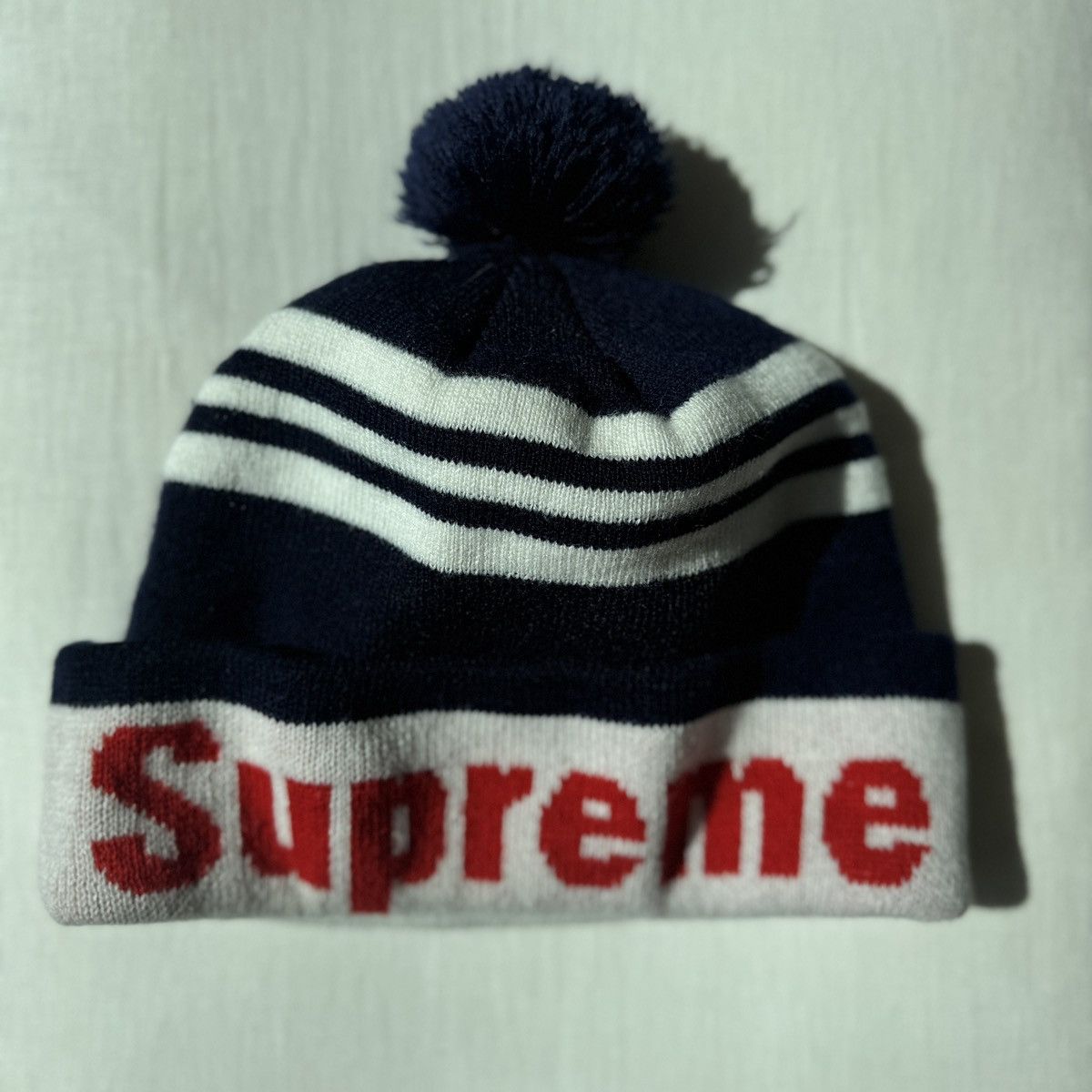 Supreme SUPREME NAVY STRIPE ACRYLIC POM BEANIE W RED LOGO Size ONE SIZE - 2 Thumbnail