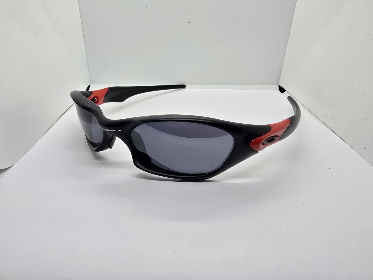 oakley valve sunglasses vintage red and black y2k
