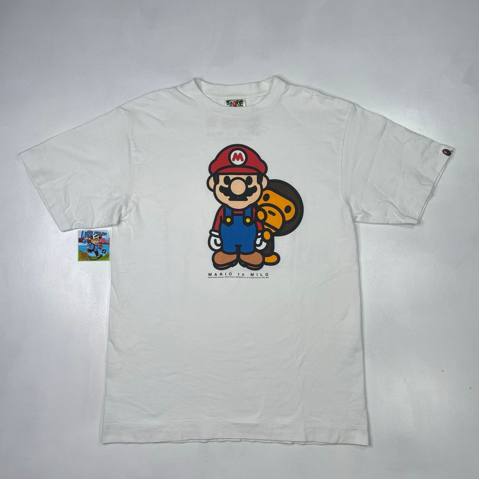 Bape × Nigo × Nintendo BAPE x Nintendo Mario Baby Milo Tee (2008) Size ...
