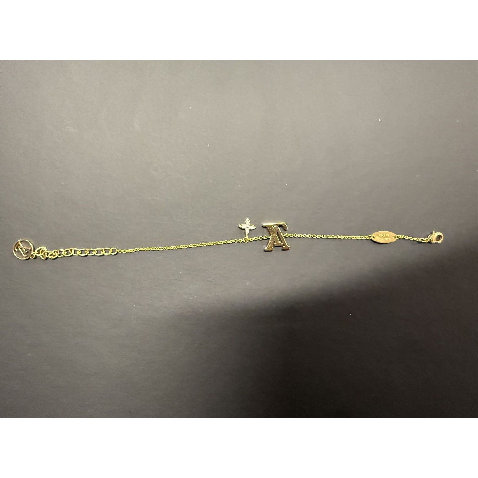 Louis Vuitton Louis Vuitton Gold-Tone Bracelet With LV Logo & Flower Charm Size ONE SIZE - 7 Thumbnail