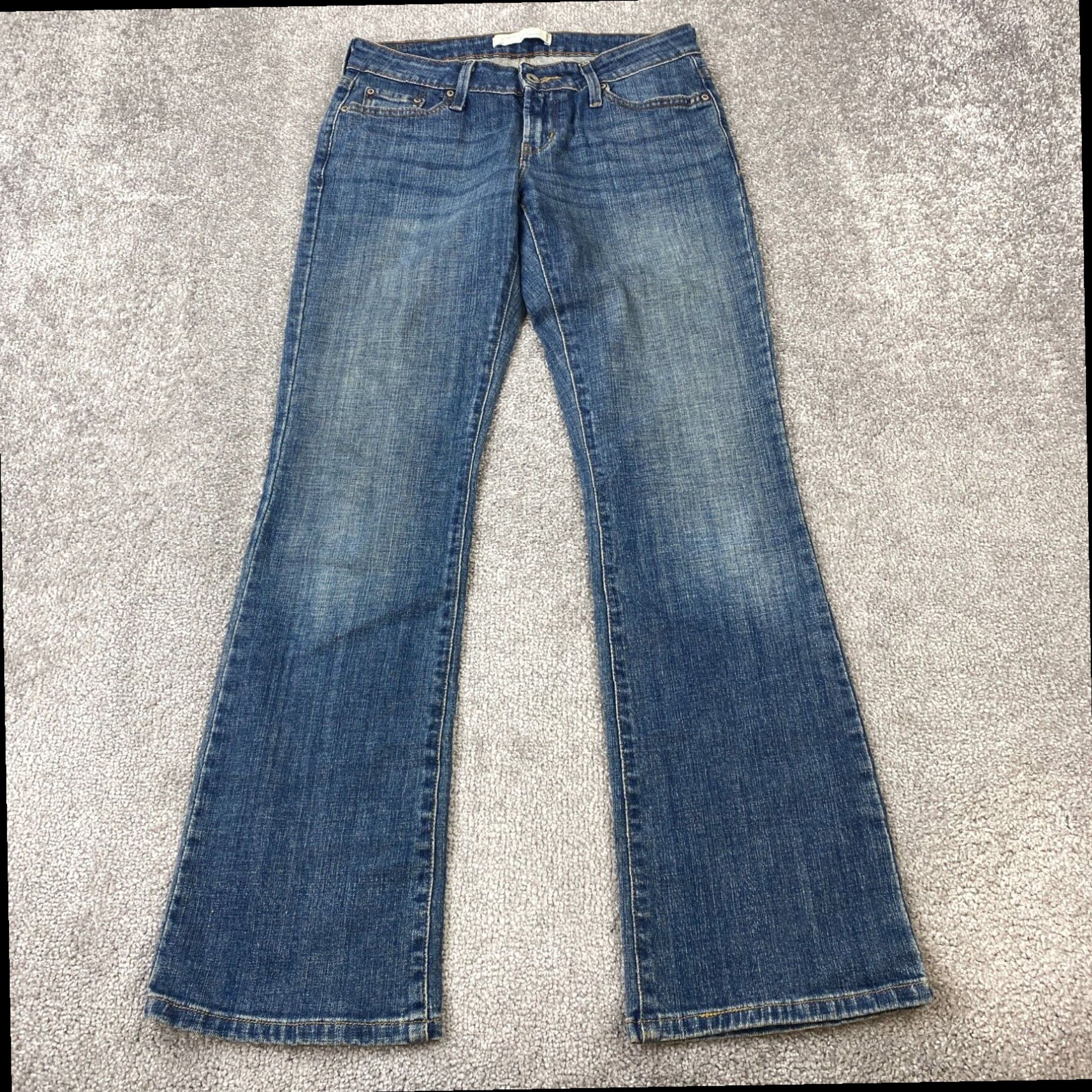 Levi s Women s Blue Medium Wash Faded 5 Pocket Low Bootcut Levi s 545 Jeans Size 4 M Grailed