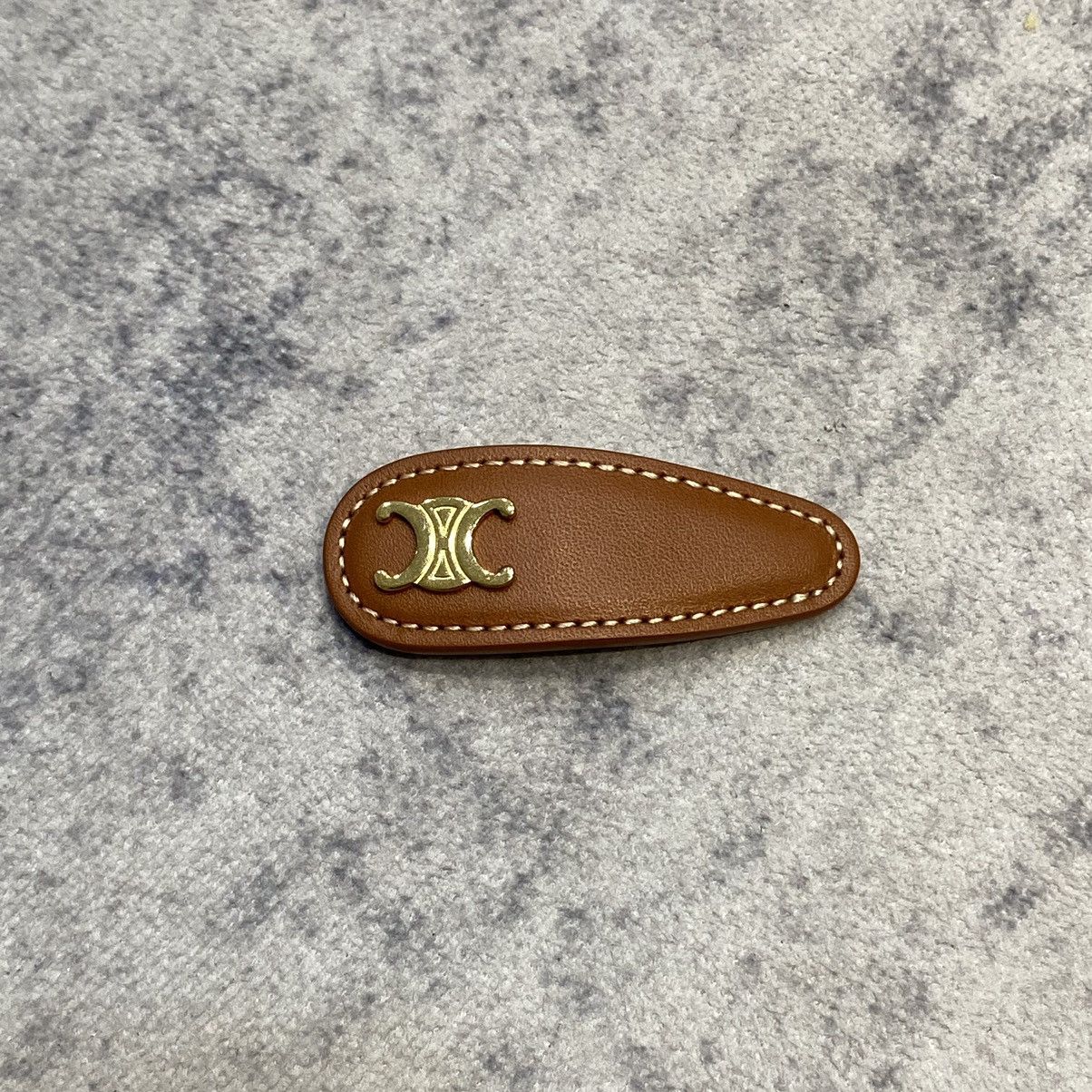 Celine CELINE Triomphe Snap Hair Clip In Calfskin TAN/GOLD Size ONE SIZE - 1 Thumbnail
