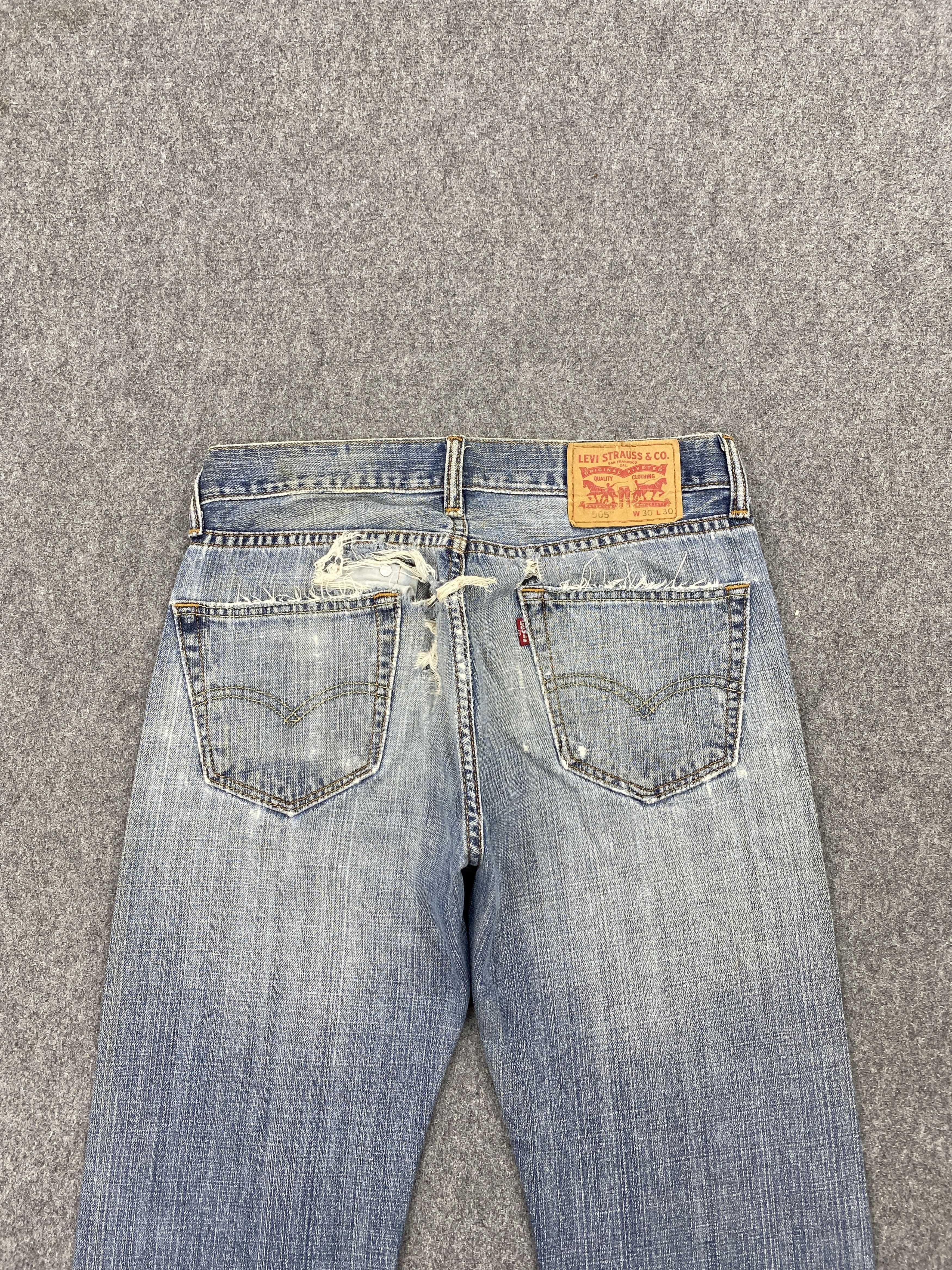 Distressed Vintage Levi's 505 Faded Blue Jeans