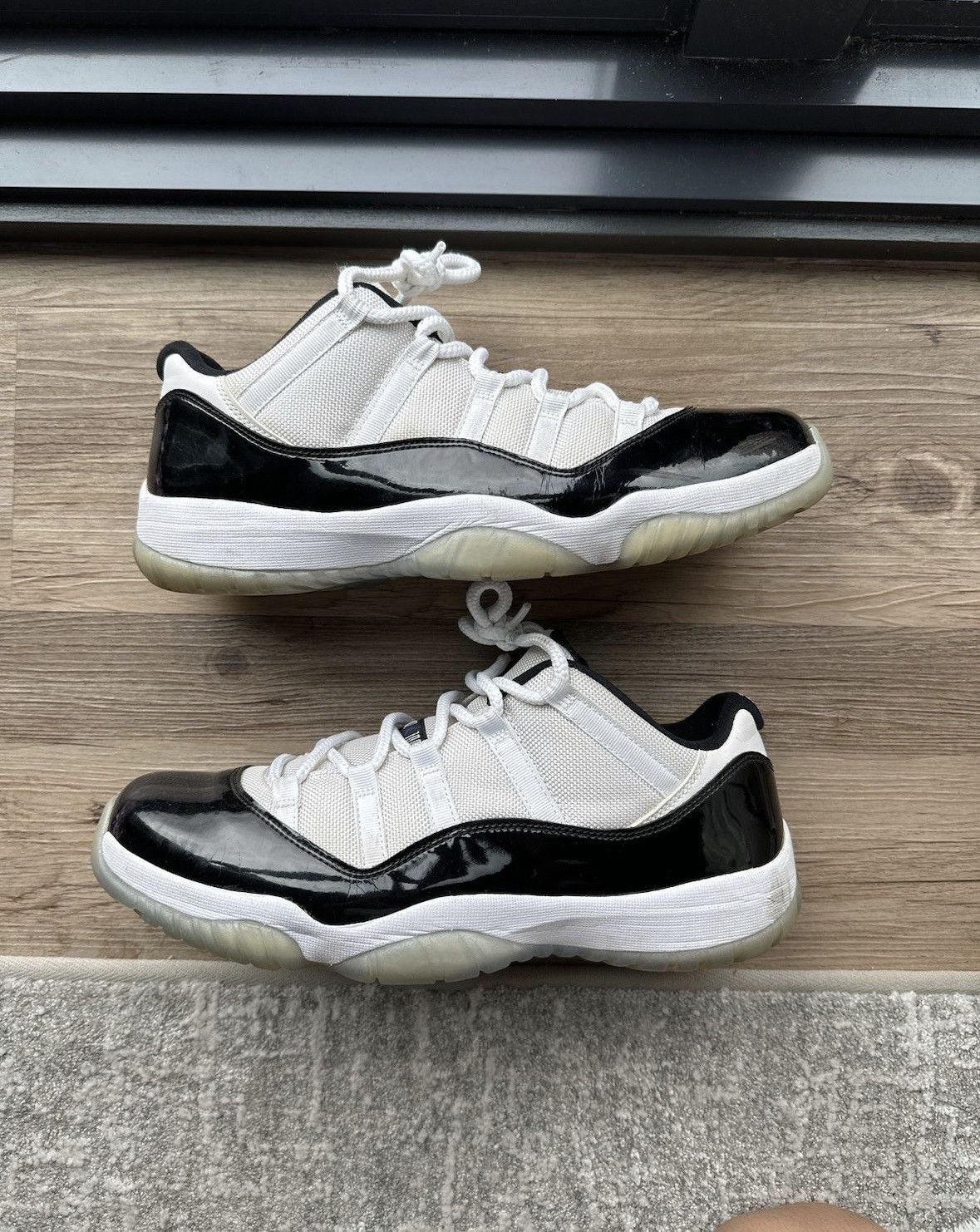 image of Jordan Brand 11 Low Concord Shoes in Black/White, Men's