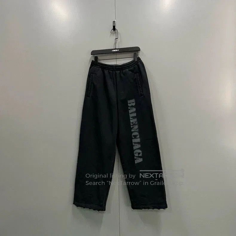 Balenciaga Distressed Logo Print Pants.
