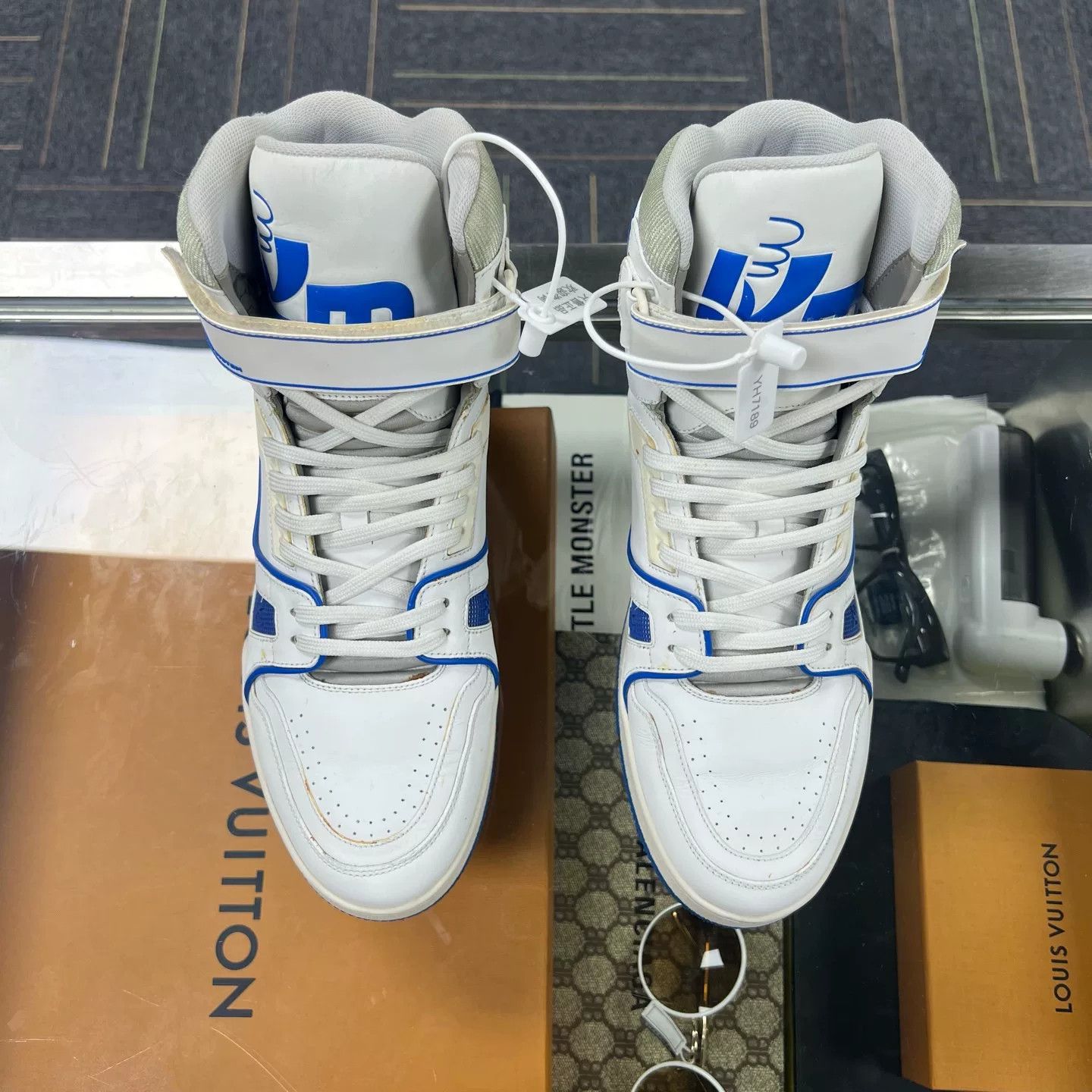 lv trainer high top white blue sneakers
