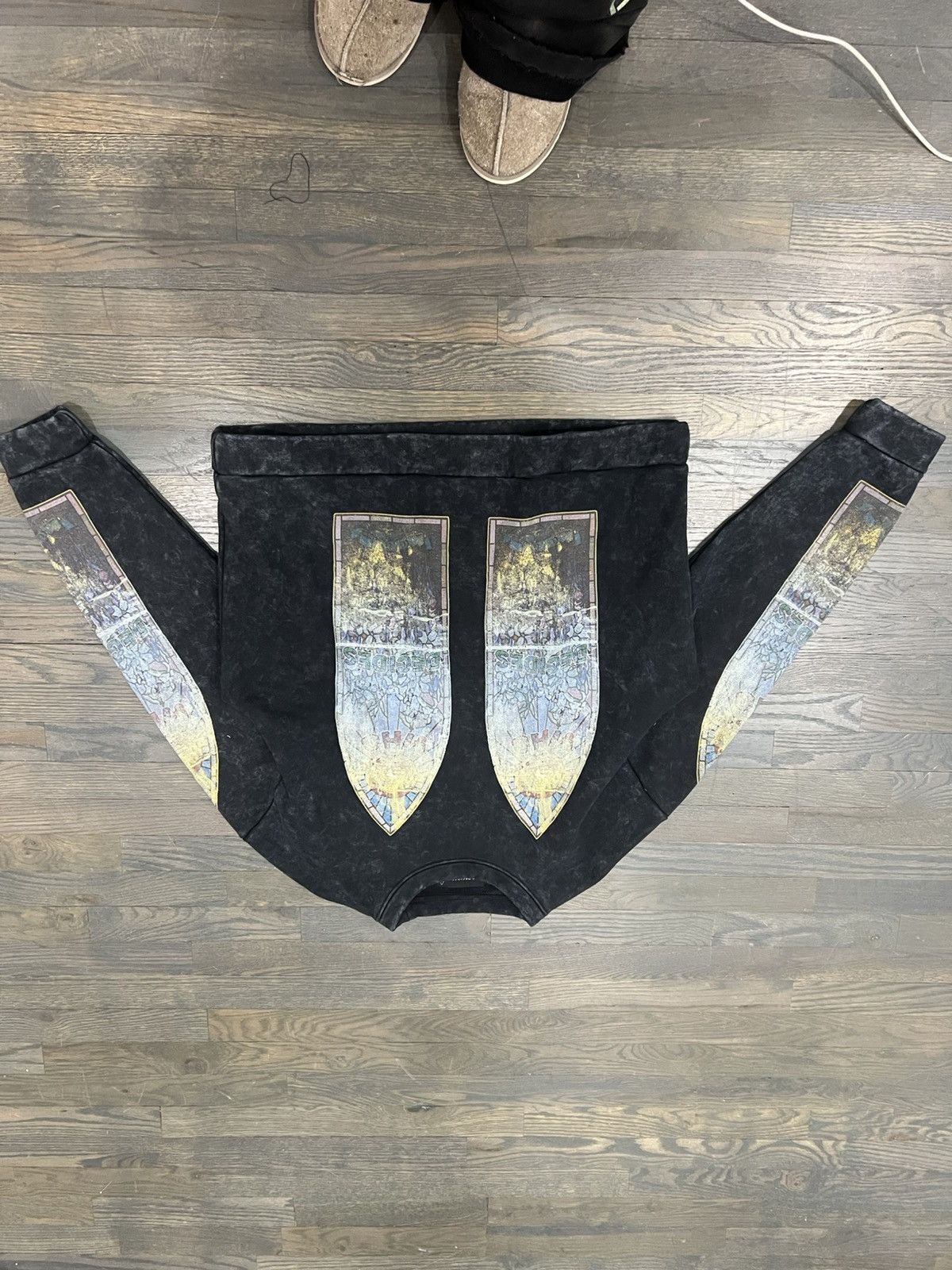 Who decides war stained glass motif crewneck