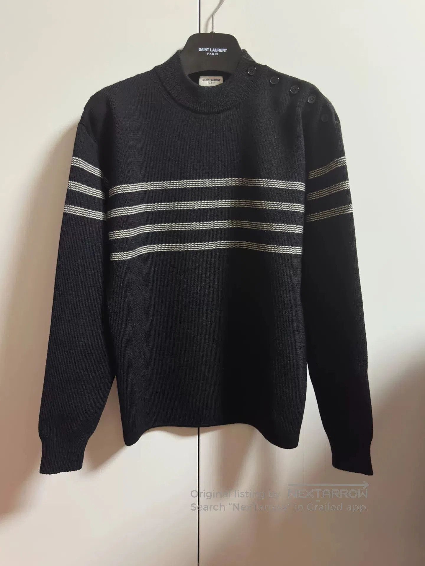 black striped shoulder button knit sweater.