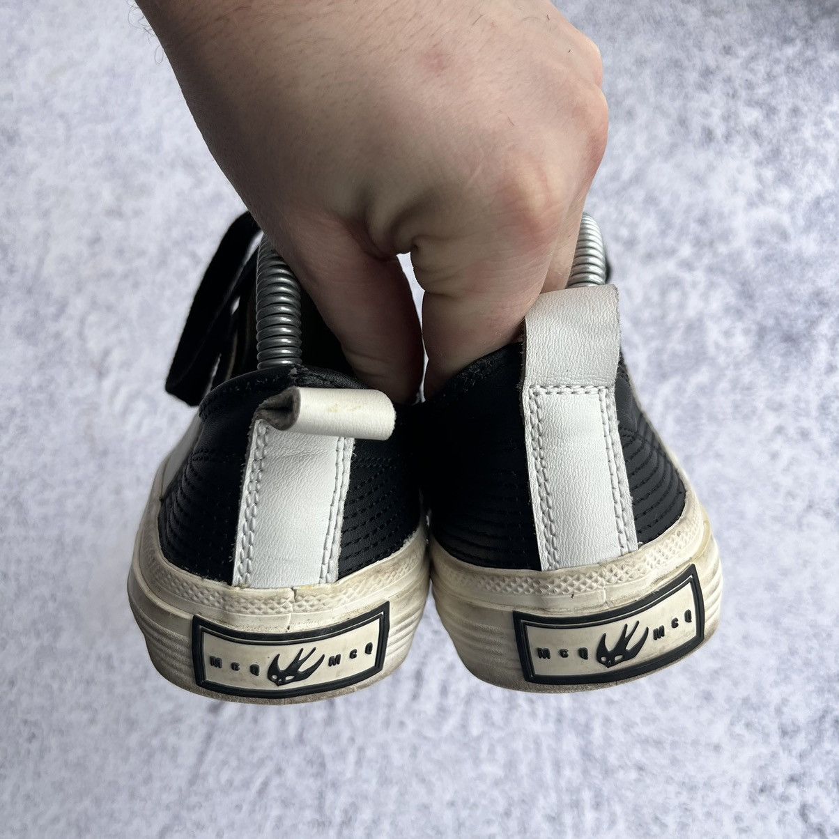 Alexander McQueen Black leather swallow plimsoll sneakers