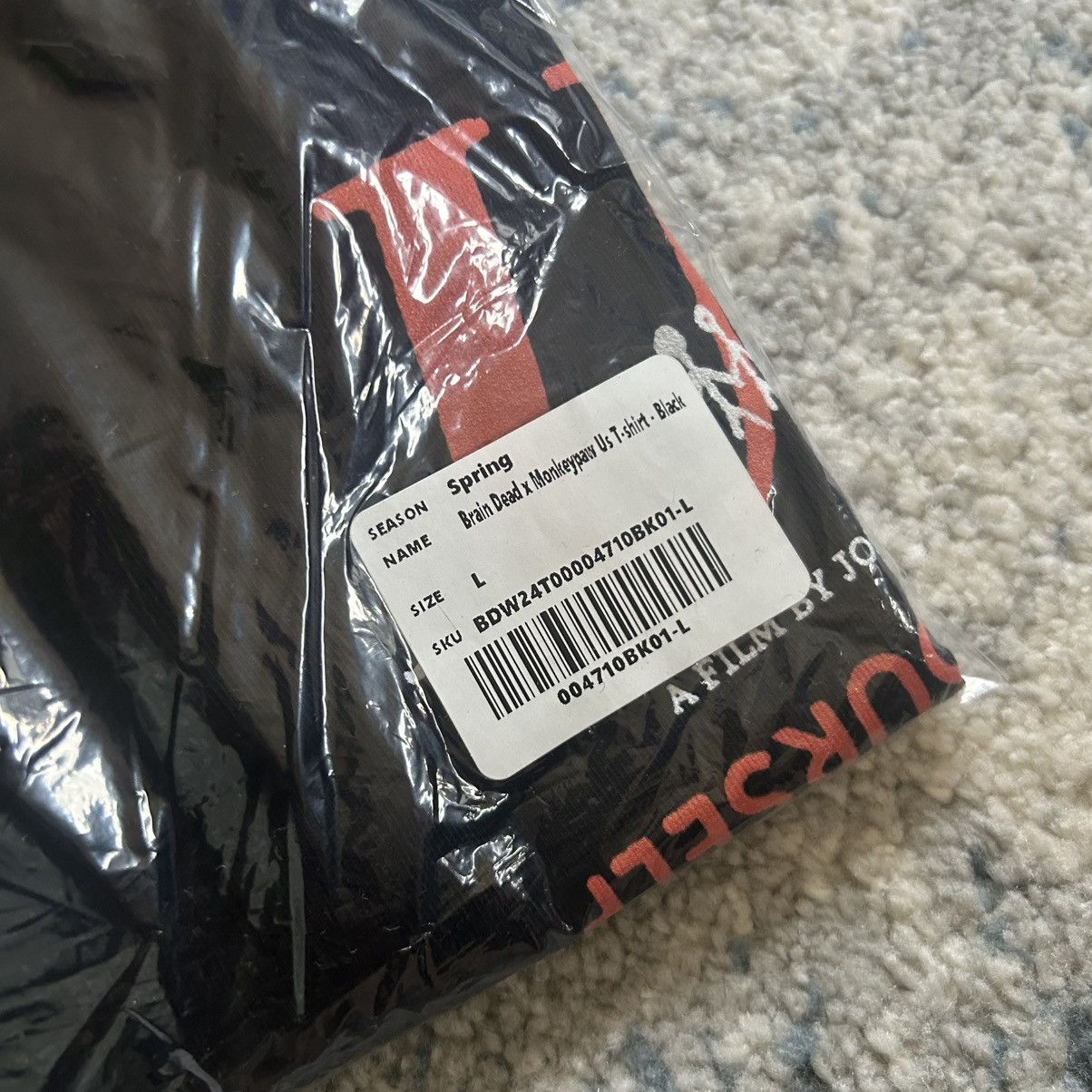 Brain Dead JORDAN PEELE US TEE MONKEYPAW PRODUCTiONS 5 YEAR ANNiVERSARY Size US L / EU 52-54 / 3 - 5 Thumbnail