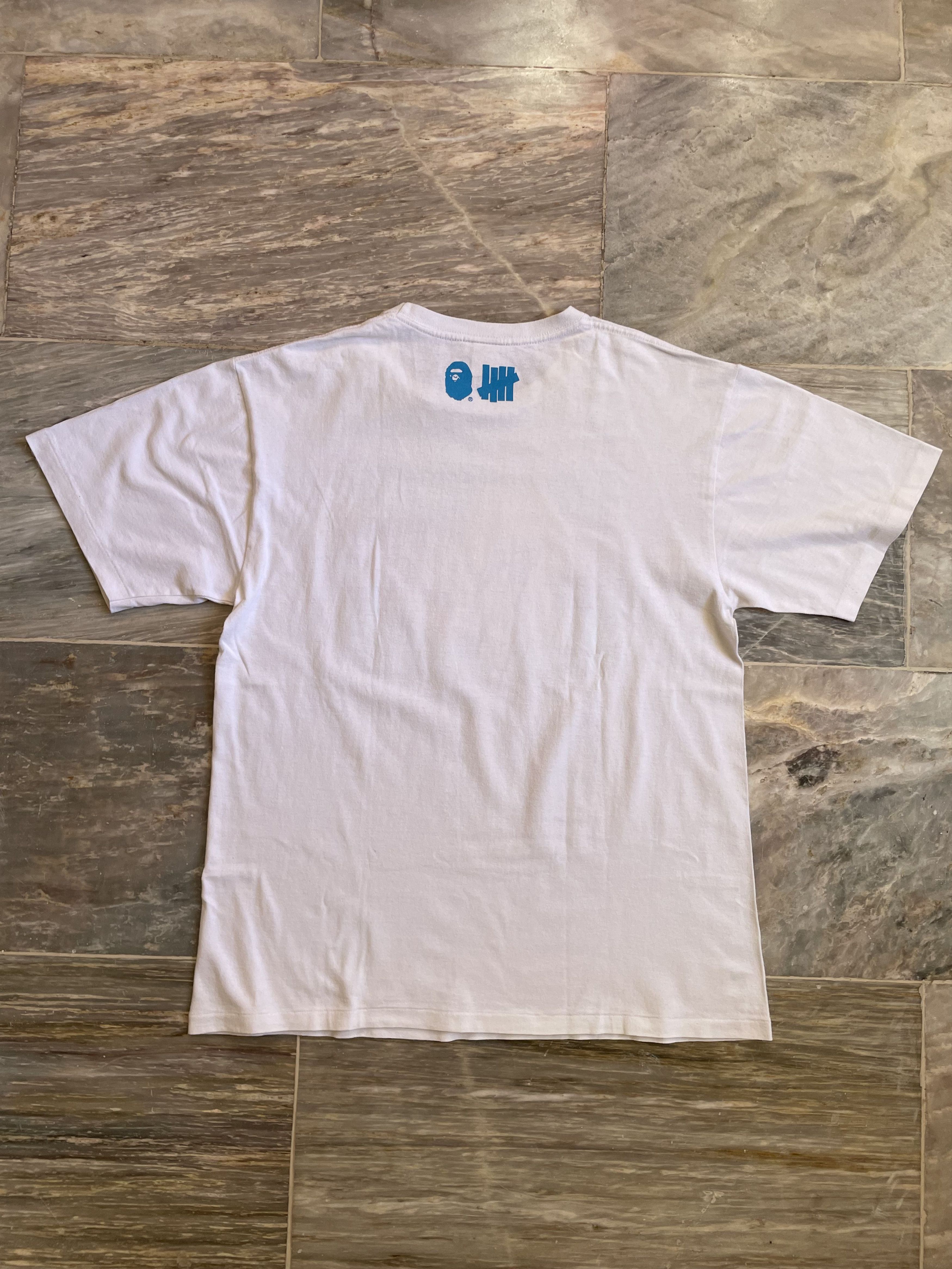 Bape × Nigo × Undefeated Bape x Undefeated Surfing Ape Tee Size US L / EU 52-54 / 3 - 9 Thumbnail