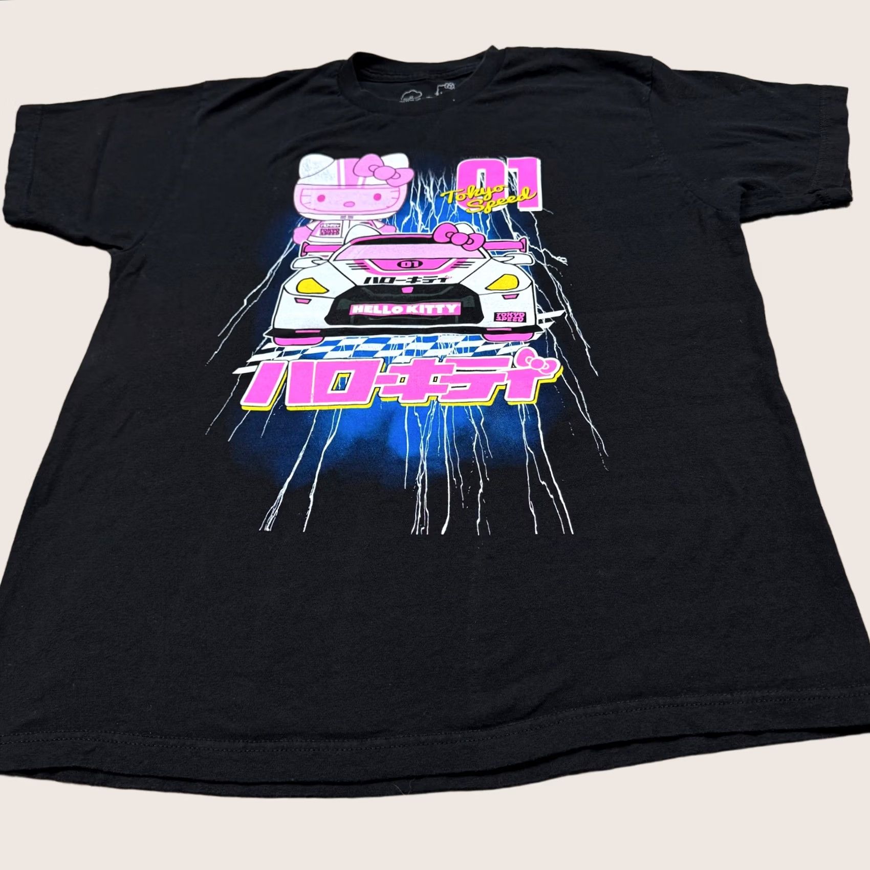 Vintage Hello Kitty Women's Shirt Black L Short Sleeve Anime Racing Car Graphic Tee Size L / US 10 / IT 46 - 1 Thumbnail