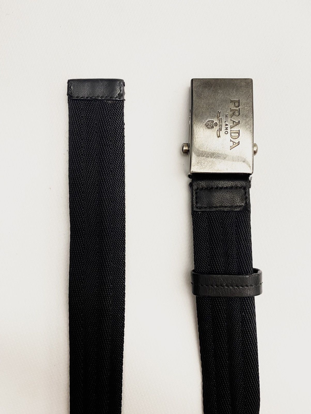 image of Italian Designers x Prada Metal Buckle Logo Belt in Black, Men's
