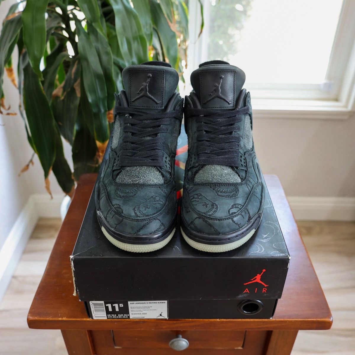 Jordan 4 retro kaws black deals