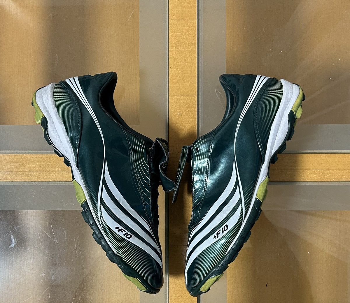 image of Adidas F10 Traxion Turf Trx Tf Cleats Soccer Shoes in Green, Men's