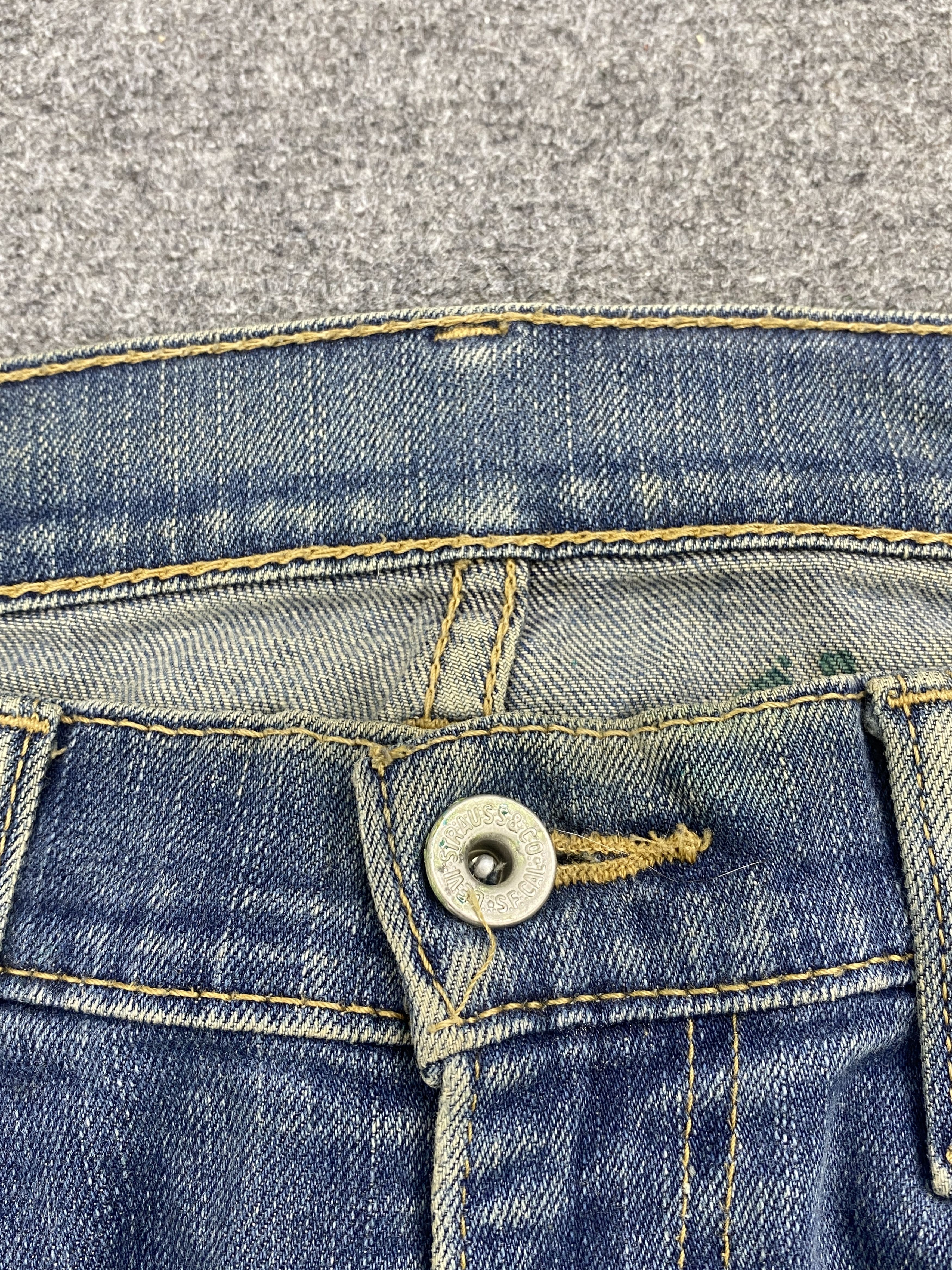 Distressed Vintage Levi's 514 Faded Blue Jeans