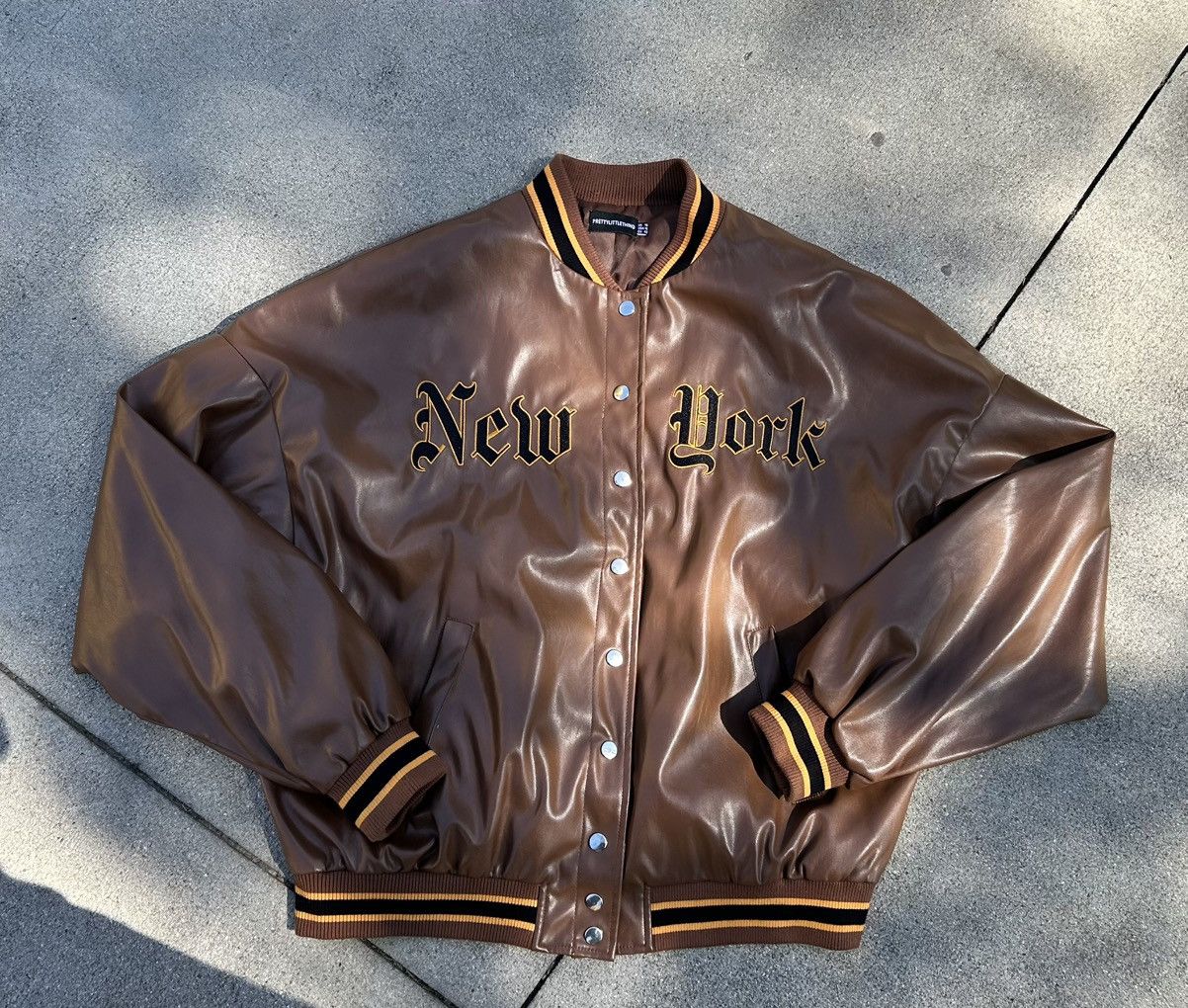 PrettyLittleThing Baggy brown leather varsity jacket with gold accents Size L / US 10 / IT 46 - 1 Thumbnail