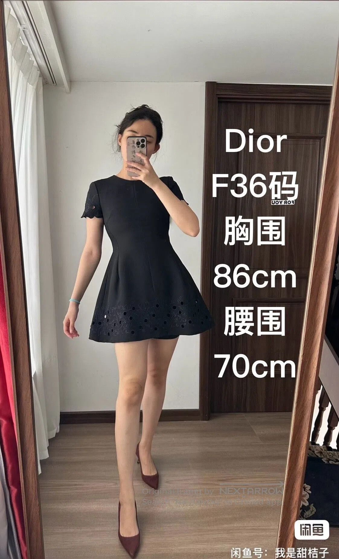 dior black dress with intricate embroidery.