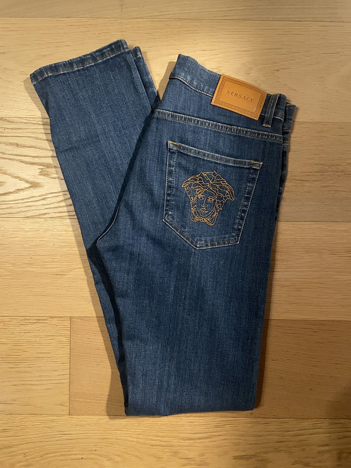 image of Versace Medusa Embroidery Denim Jeans in Navy, Men's (Size 31)