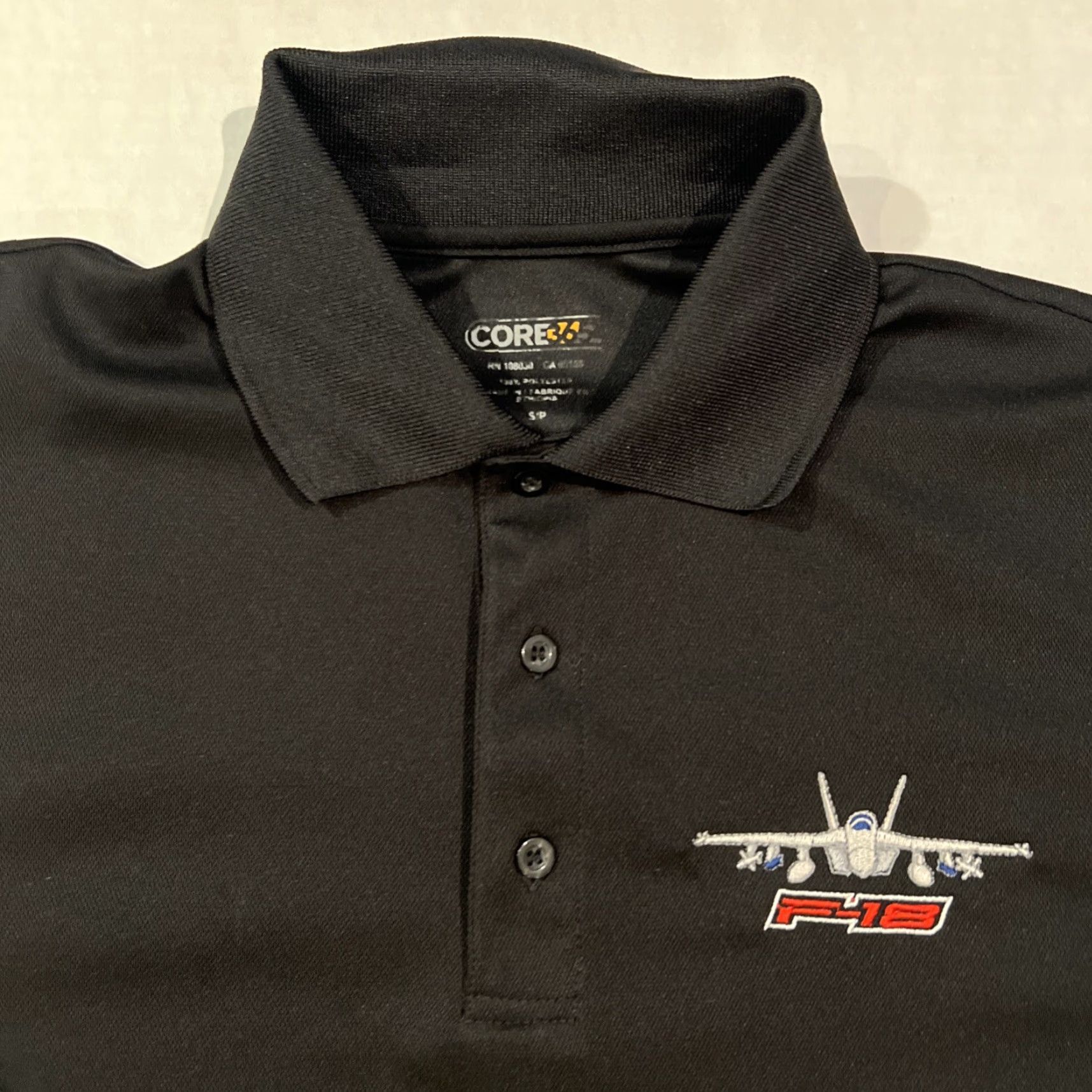 Vintage VINTAGE? US Navy F-18 Falcon Strike Fighter Polo Shirt Adult Small Black Official New Size US S / EU 44-46 / 1 - 2 Thumbnail