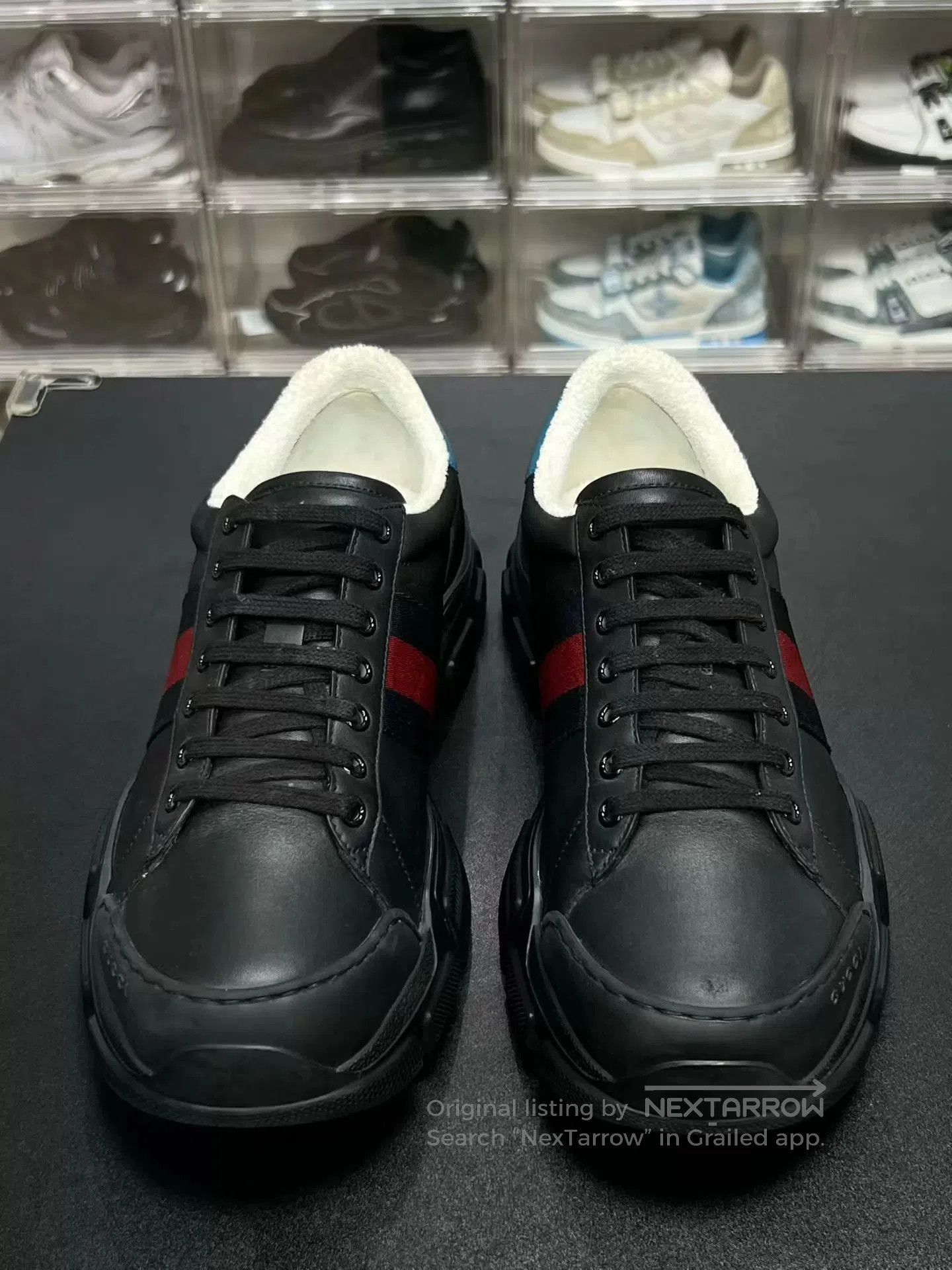 Black Low-Top Sneakers with Red and Blue Stripes.
