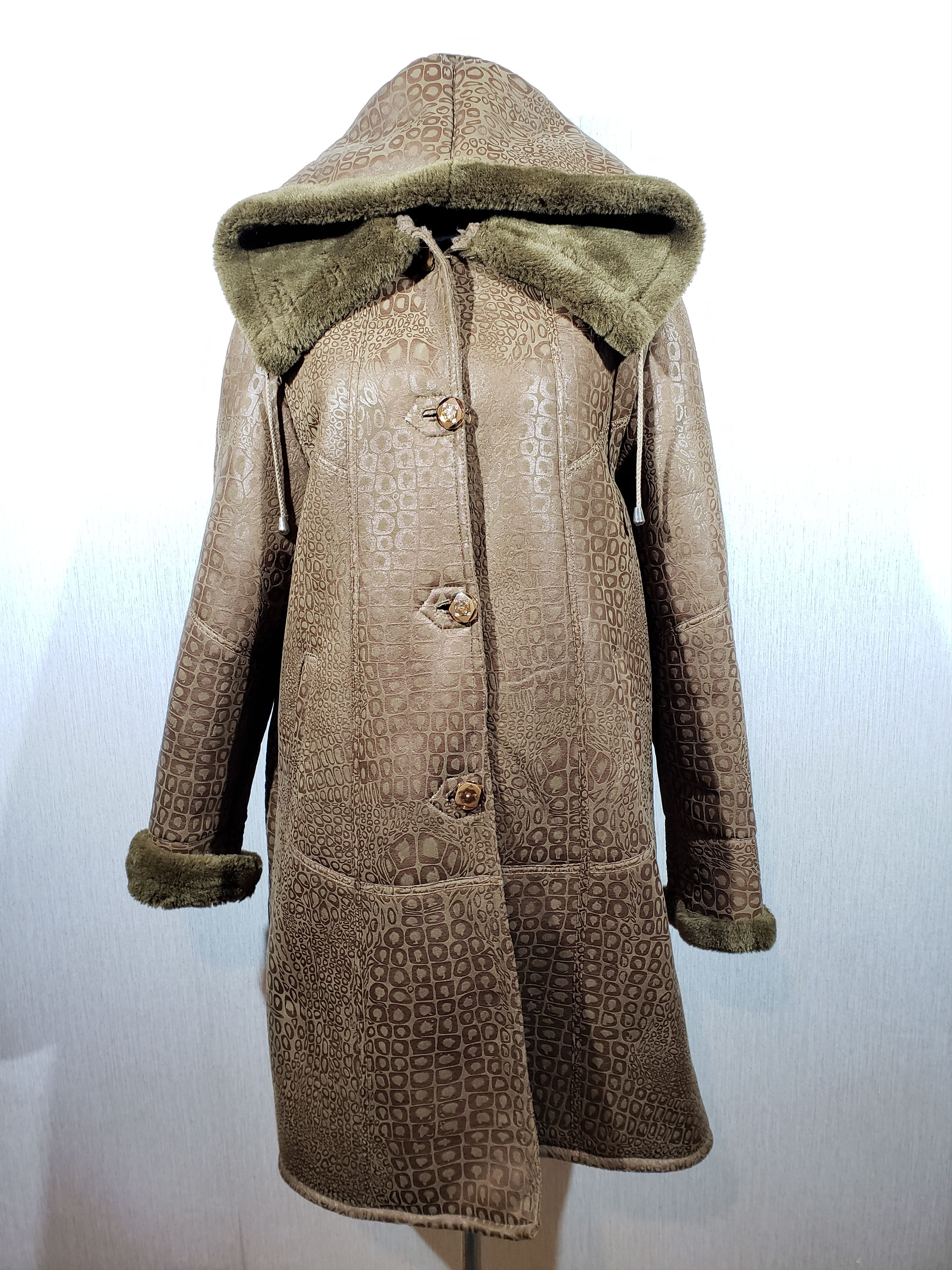 Wonderful warm women's sheepskin coat made of faux fur.