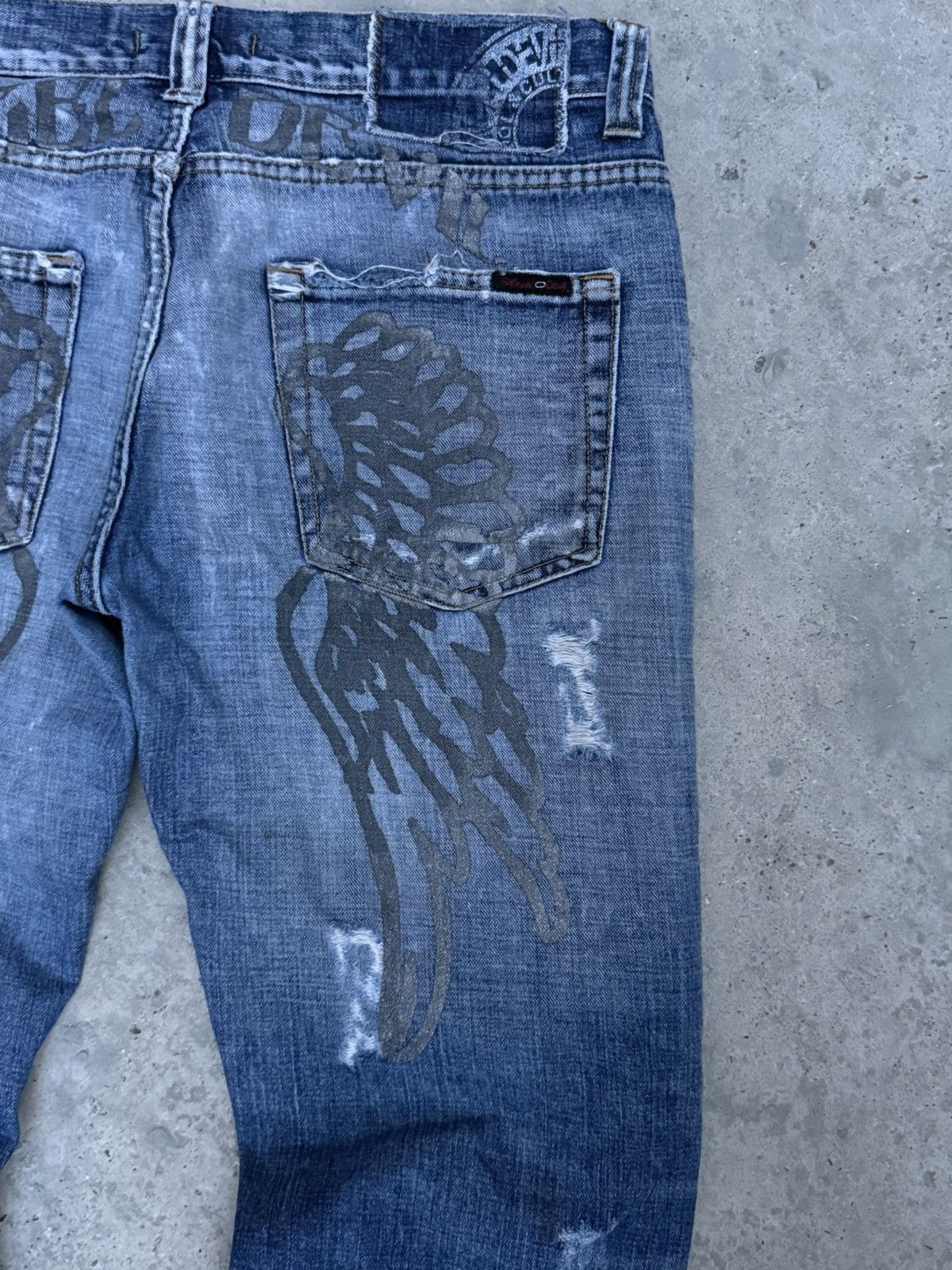 VINTAGE DISTRESSED WINGS DENIM JEANS