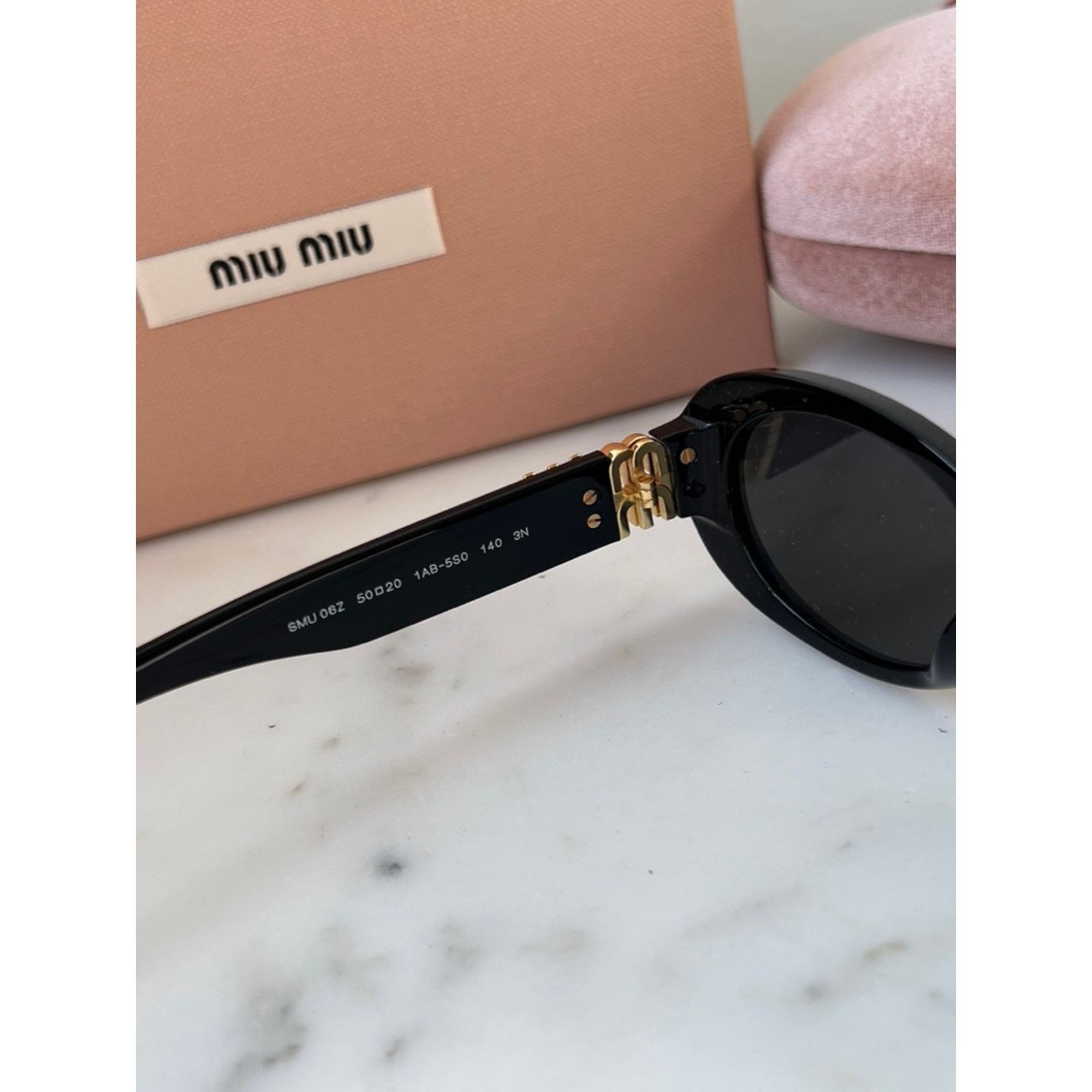 Miu Miu NEW Miu Miu MU06ZS Black Oval Sunglasses | Grailed