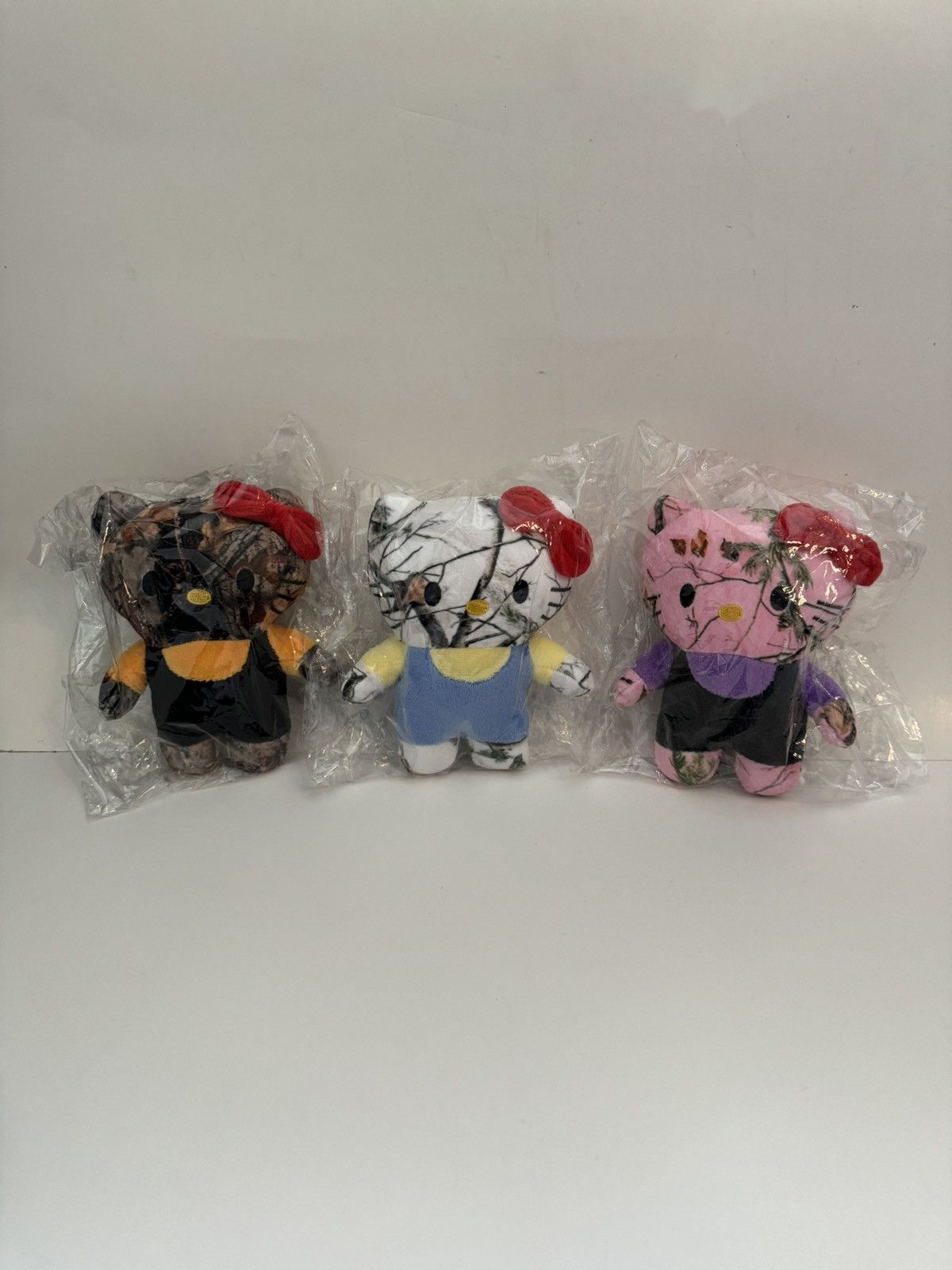 image of Asspizza Fake Tree Hello Kitty Camo Plushies, Men's