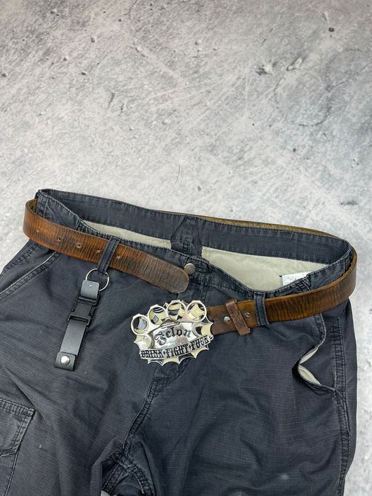 Man's Brass Knuckles Also His Belt Buckle, Pants Fall Down After